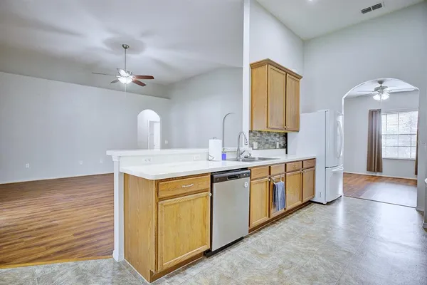 a view of a kitchen with a sink and a dishwasher