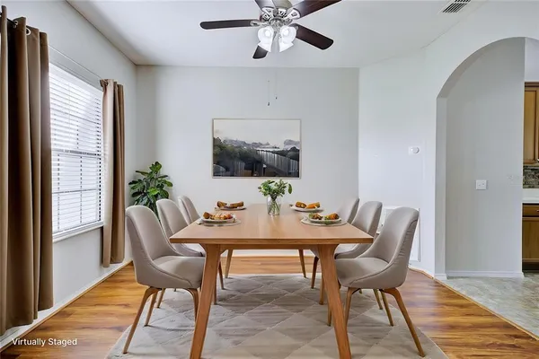 a view of a dining room with furniture window and wooden floor