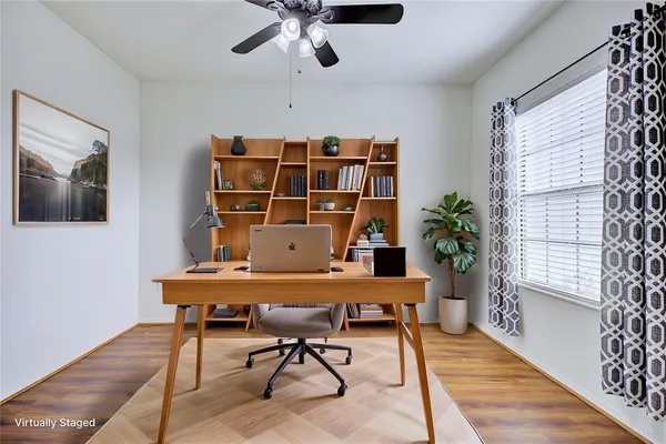 a workspace with furniture and window
