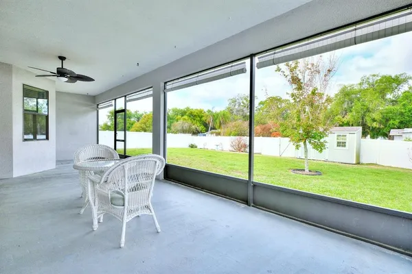 a dining room with furniture and garden view