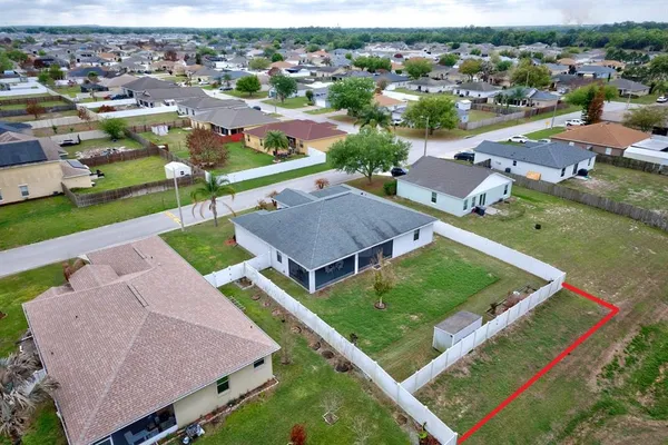a view of a street with palm trees