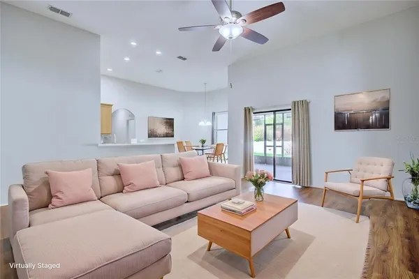 a living room with furniture and a large window