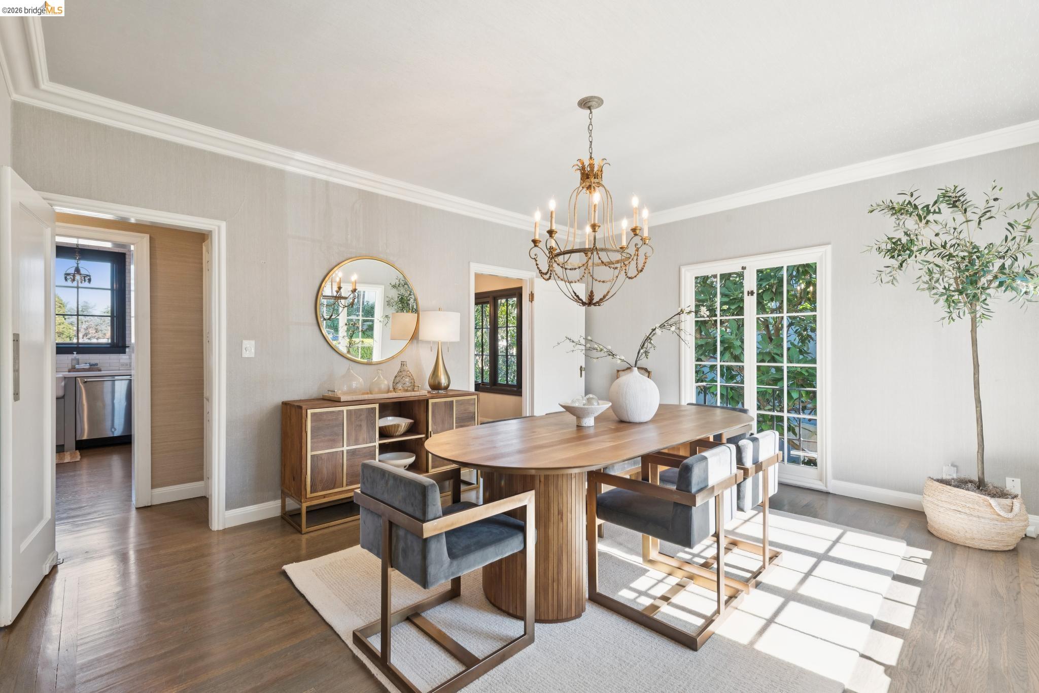 906 Paramount Road Oakland, CA 94610 - Photo 14 of 60 a view of a dining room with furniture a chandelier and wooden floor