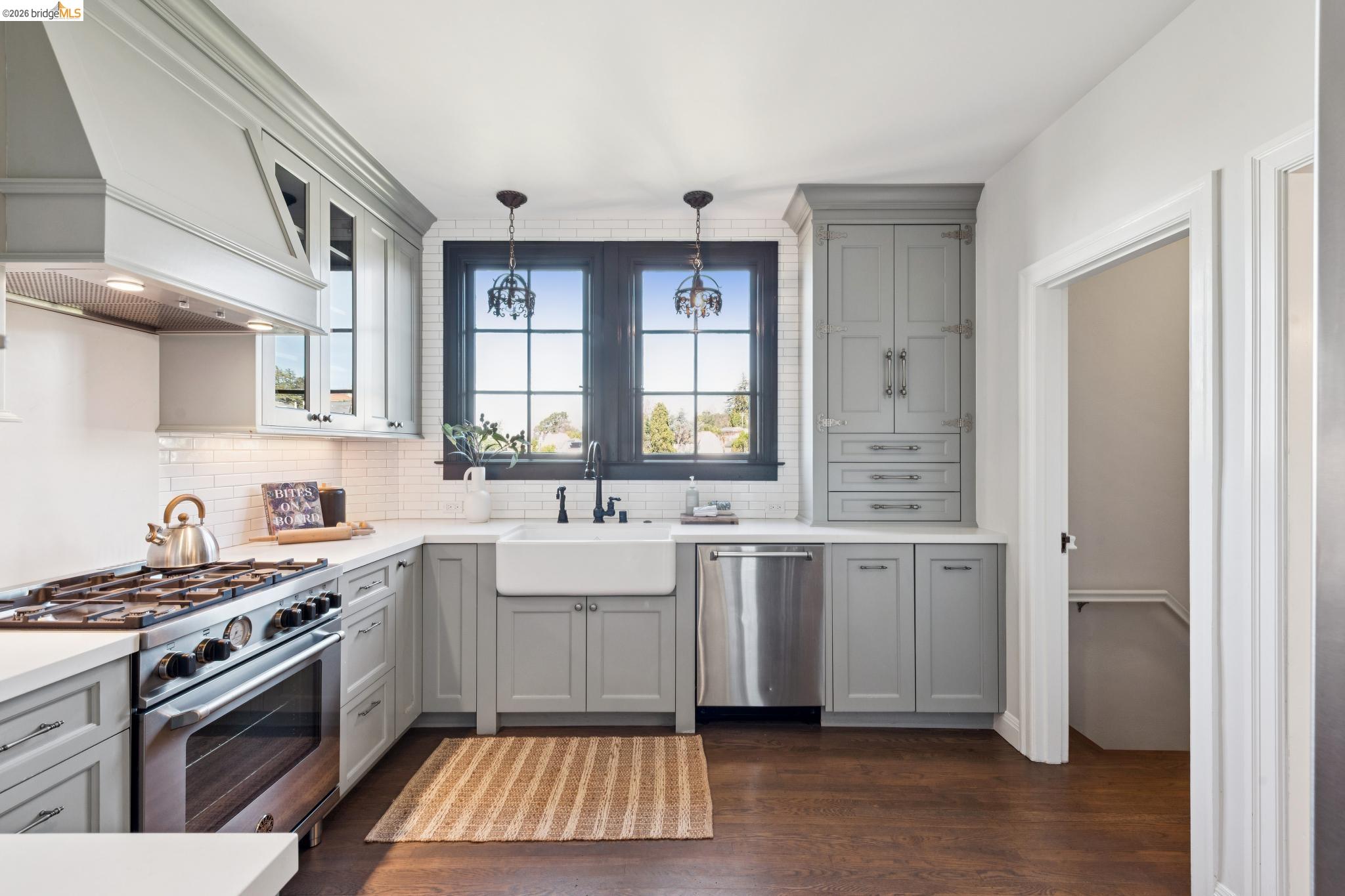 906 Paramount Road Oakland, CA 94610 - Photo 18 of 60 a kitchen with a sink stove and cabinets