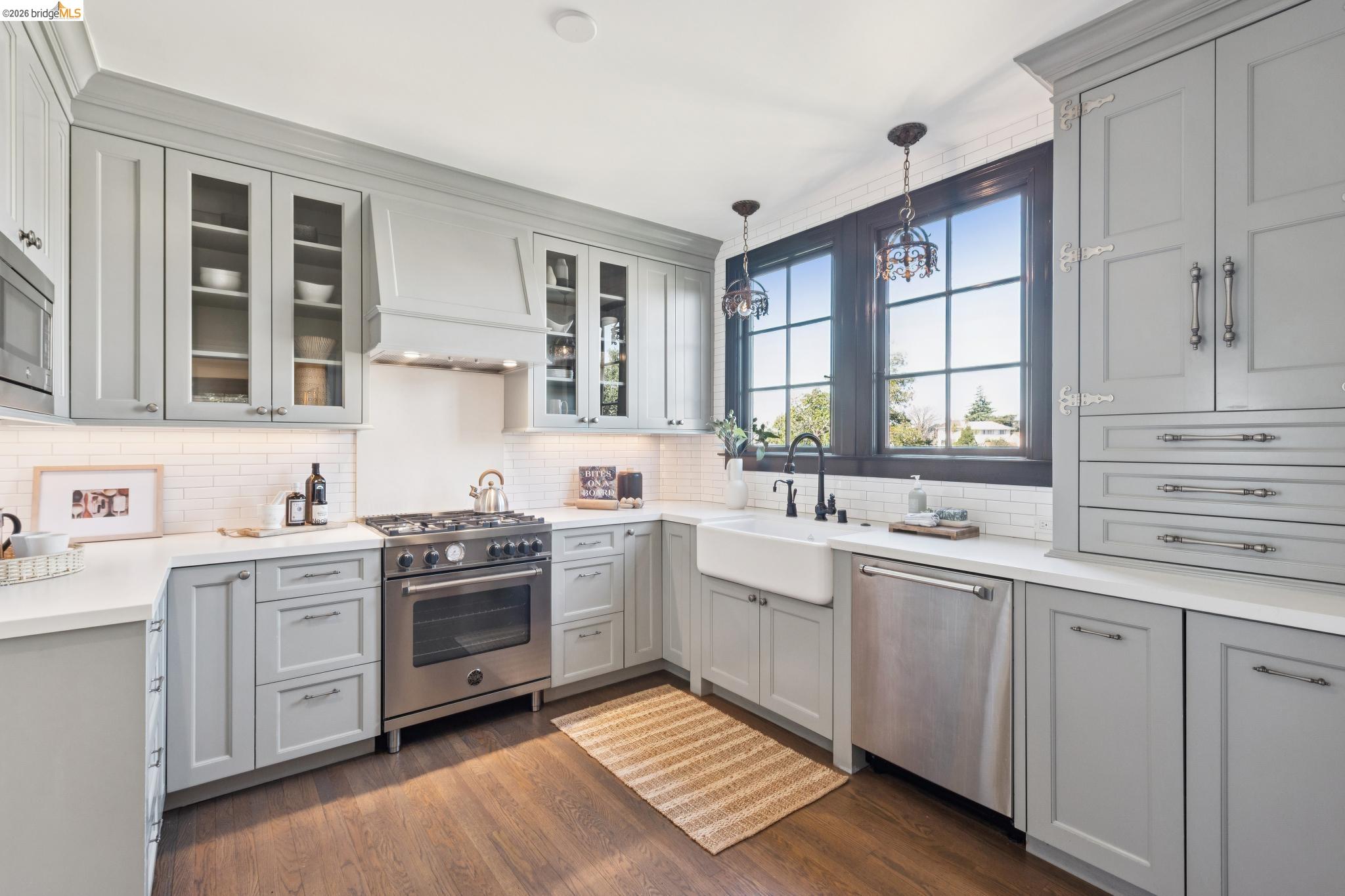906 Paramount Road Oakland, CA 94610 - Photo 19 of 60 a kitchen with a sink stove and cabinets