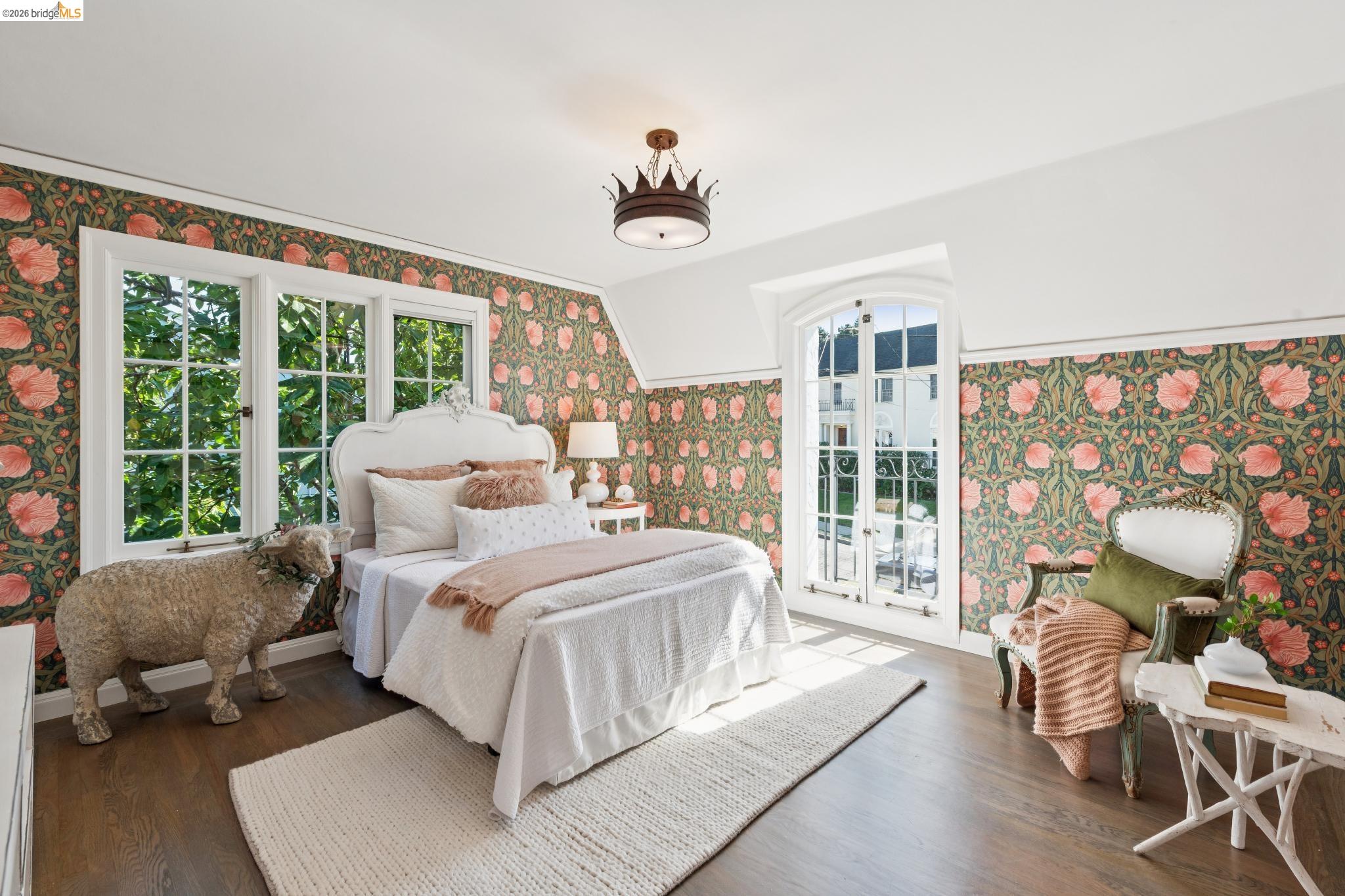 906 Paramount Road Oakland, CA 94610 - Photo 26 of 60 a bedroom with a bed and glass windows