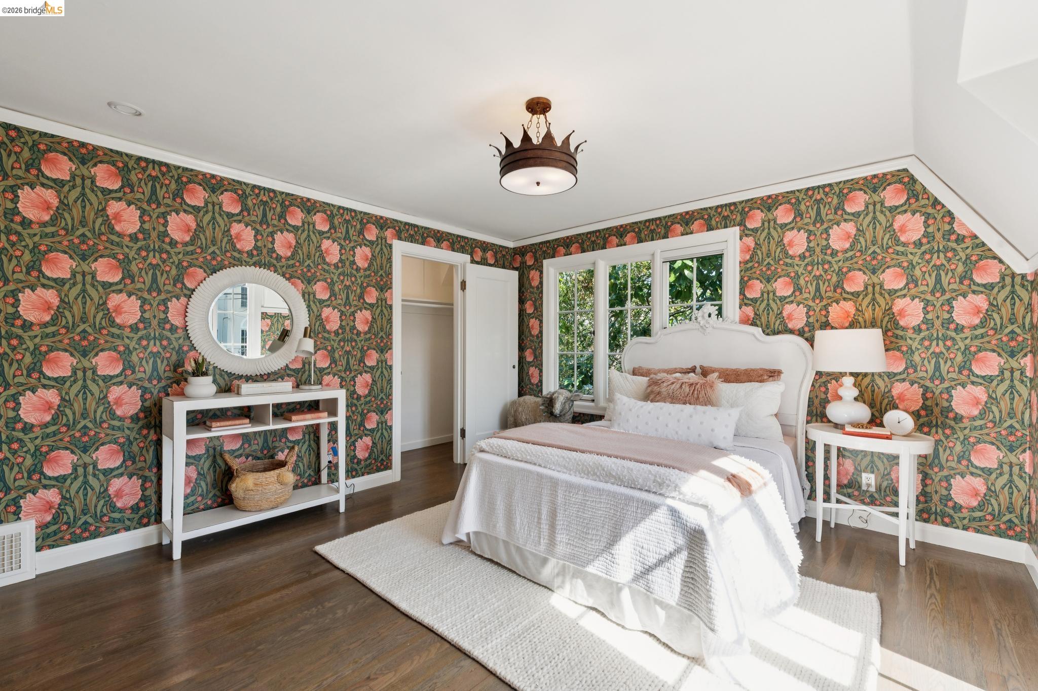 906 Paramount Road Oakland, CA 94610 - Photo 28 of 60 a bedroom with furniture and a large window