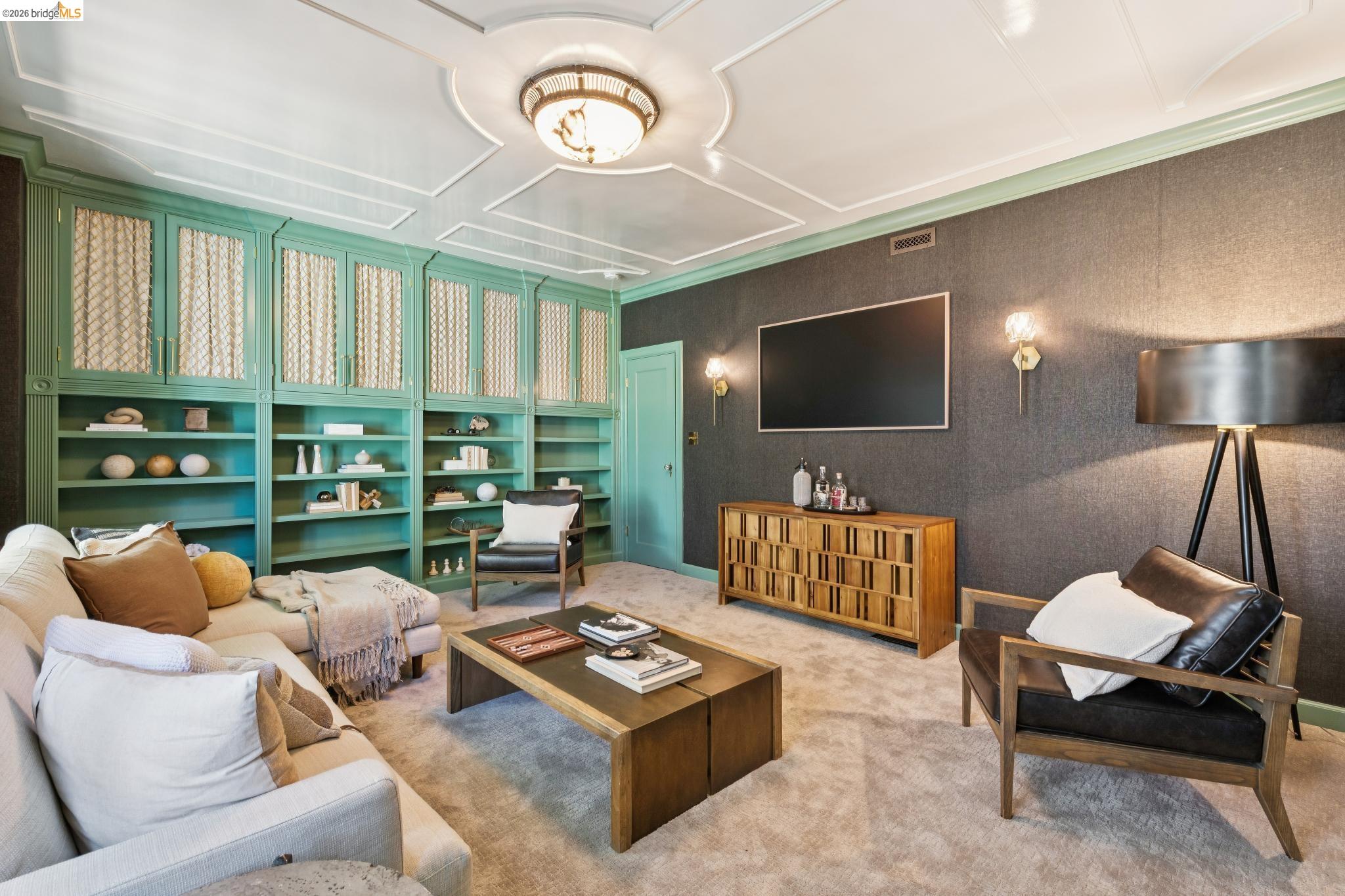 906 Paramount Road Oakland, CA 94610 - Photo 34 of 60 a living room with furniture and a flat screen tv