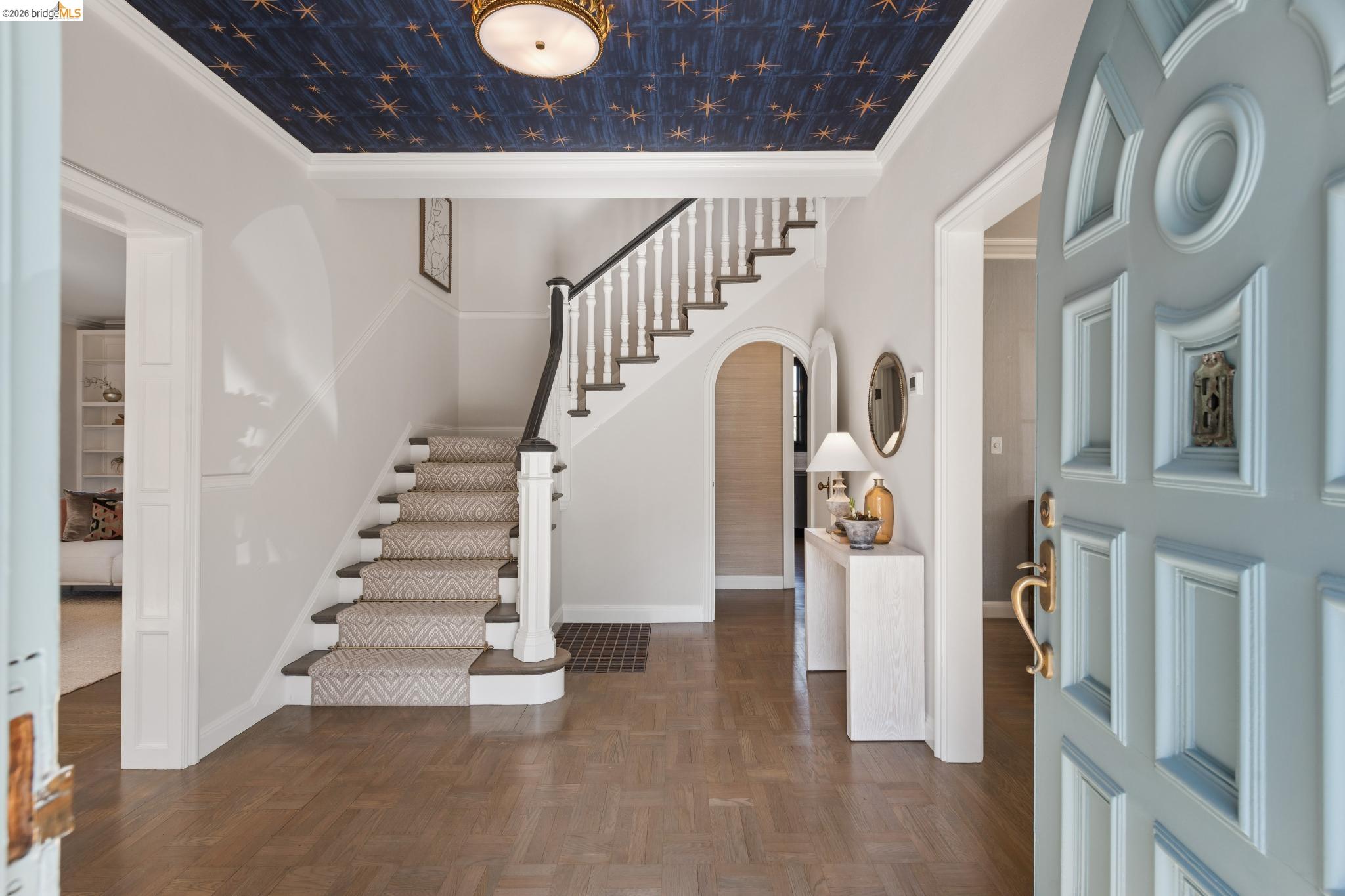 906 Paramount Road Oakland, CA 94610 - Photo 4 of 60 a view of staircase with lots of frames on wall and a large window