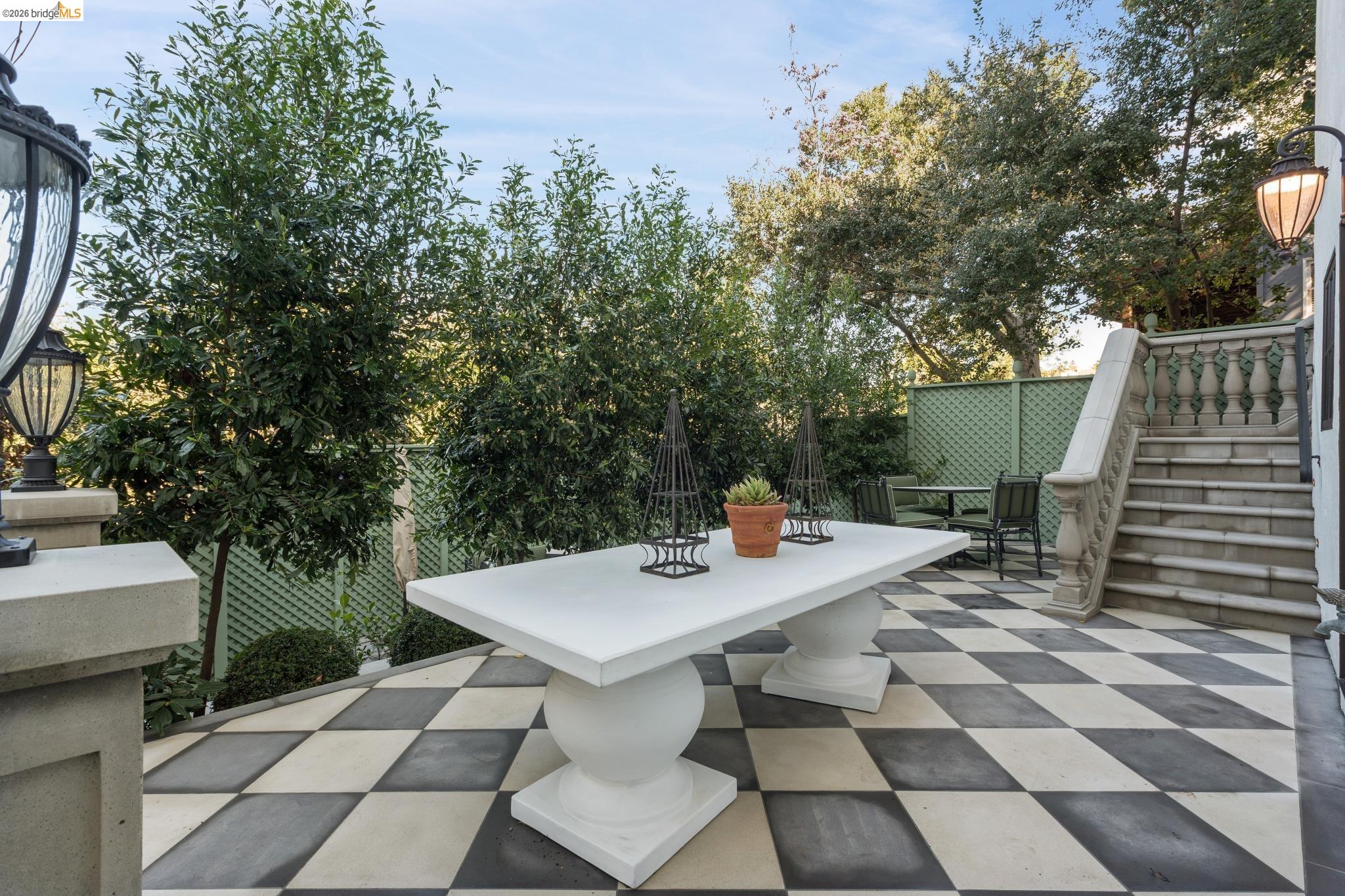 906 Paramount Road Oakland, CA 94610 - Photo 43 of 60 a view of a patio with a table and chairs