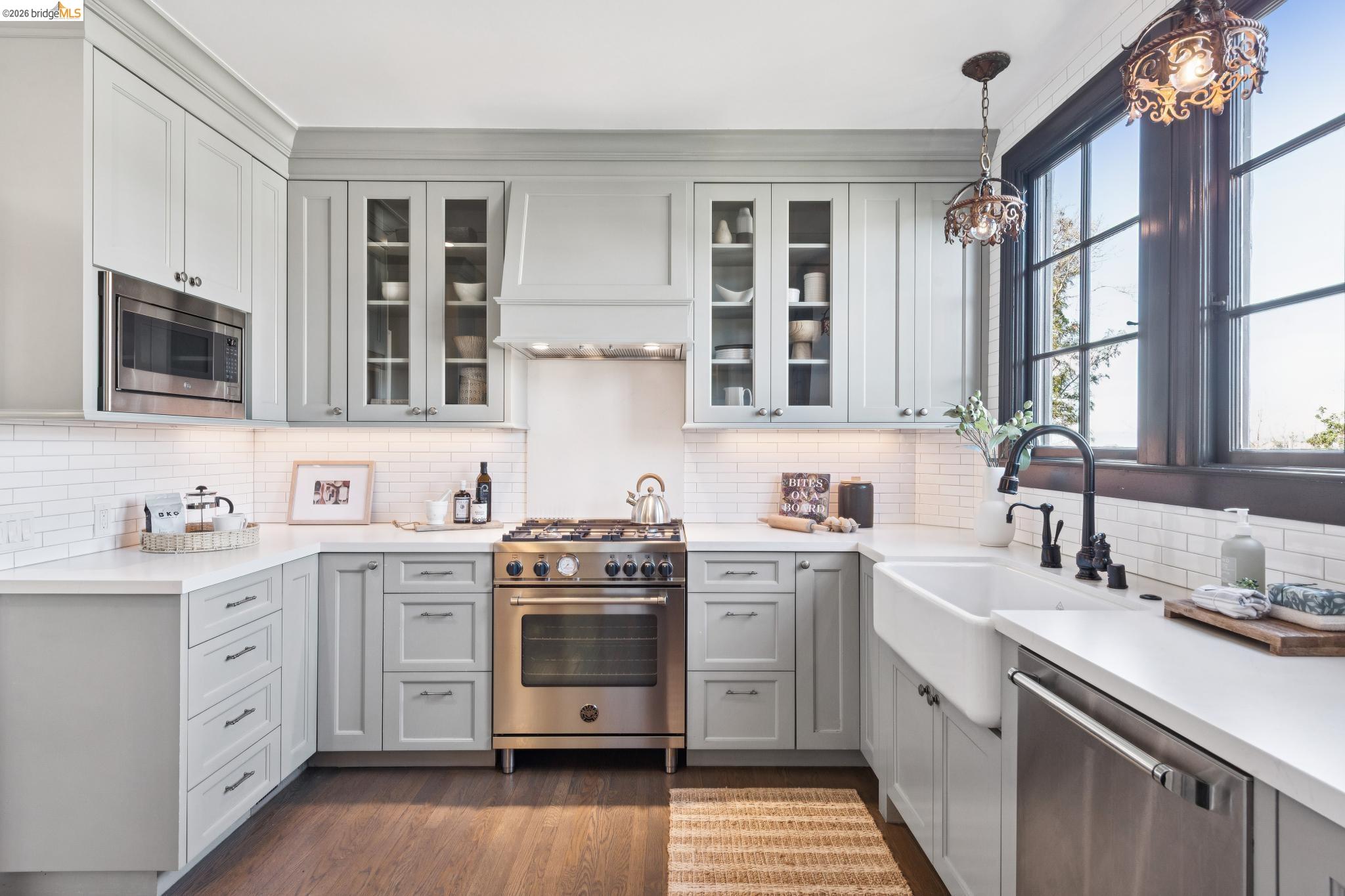 906 Paramount Road Oakland, CA 94610 - Photo 47 of 60 a kitchen with stainless steel appliances a sink stove and cabinets