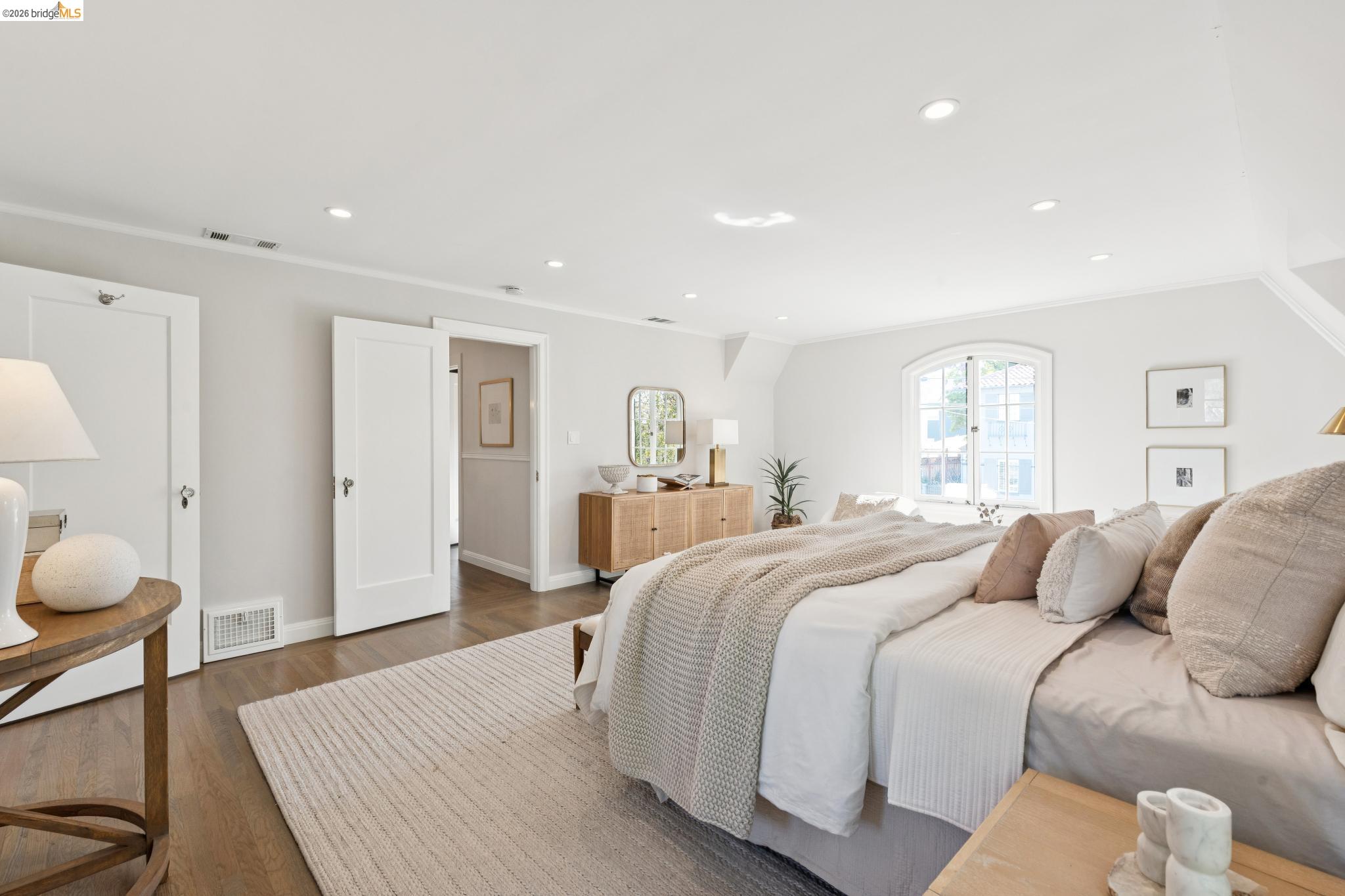 906 Paramount Road Oakland, CA 94610 - Photo 56 of 60 a bedroom with a bed and a chandelier