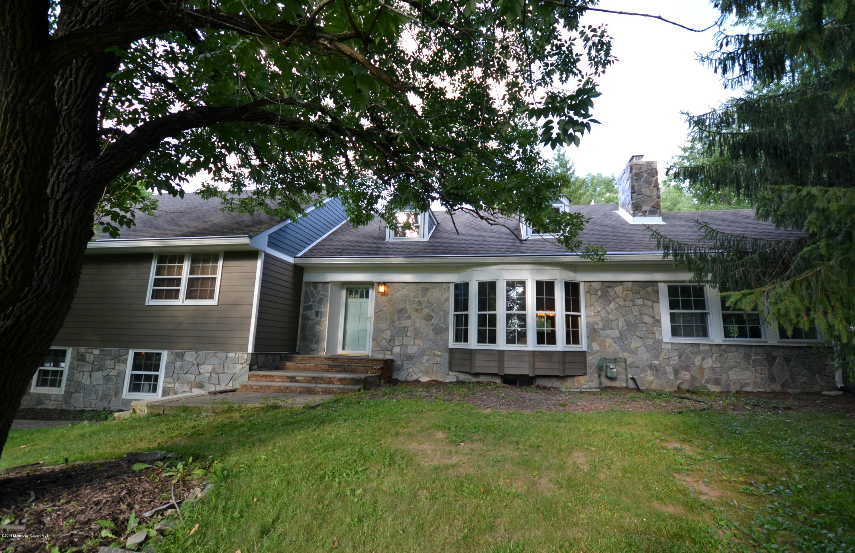 4 Spring Lane Warren, NJ 07059 - Photo 1 of 22 a front view of a house with a garden