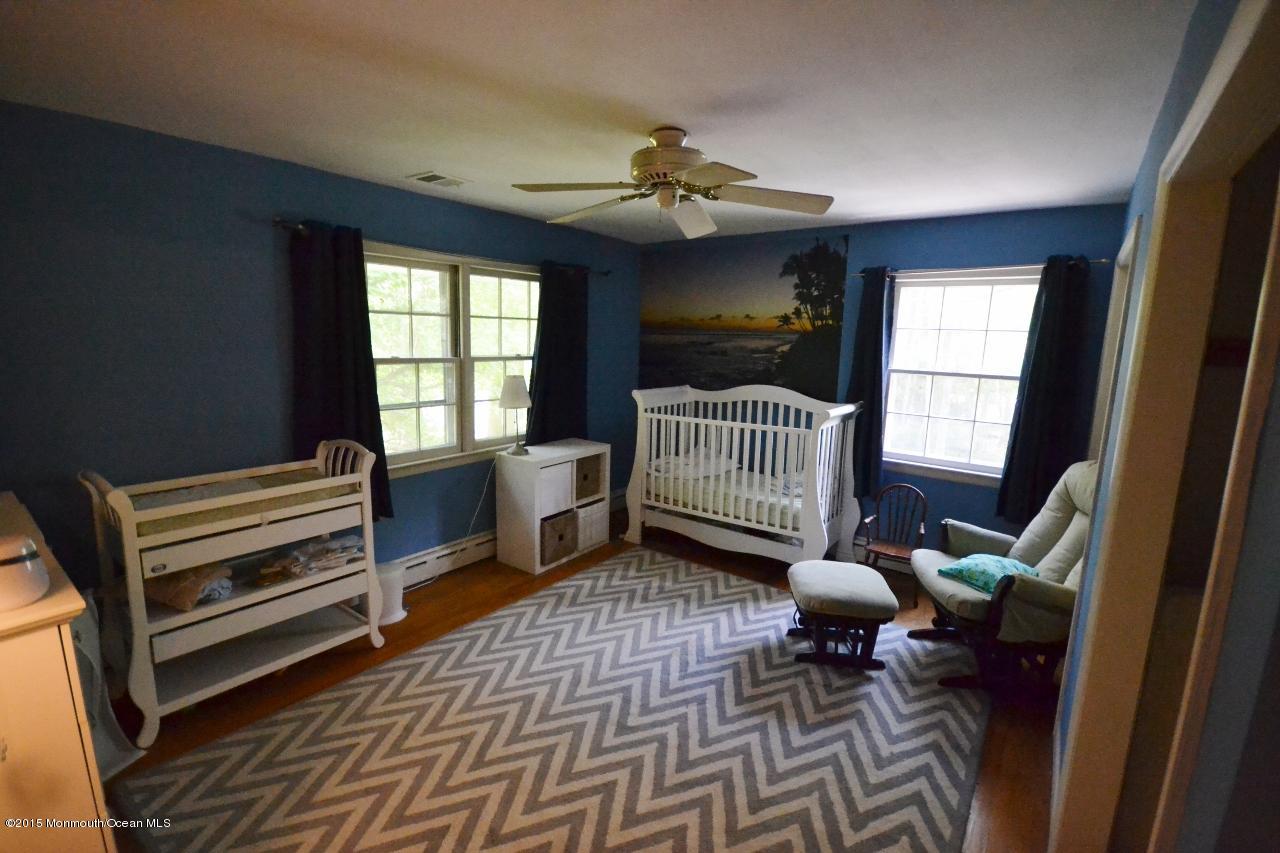 4 Spring Lane Warren, NJ 07059 - Photo 14 of 22 a living room with furniture a flat screen tv and a window