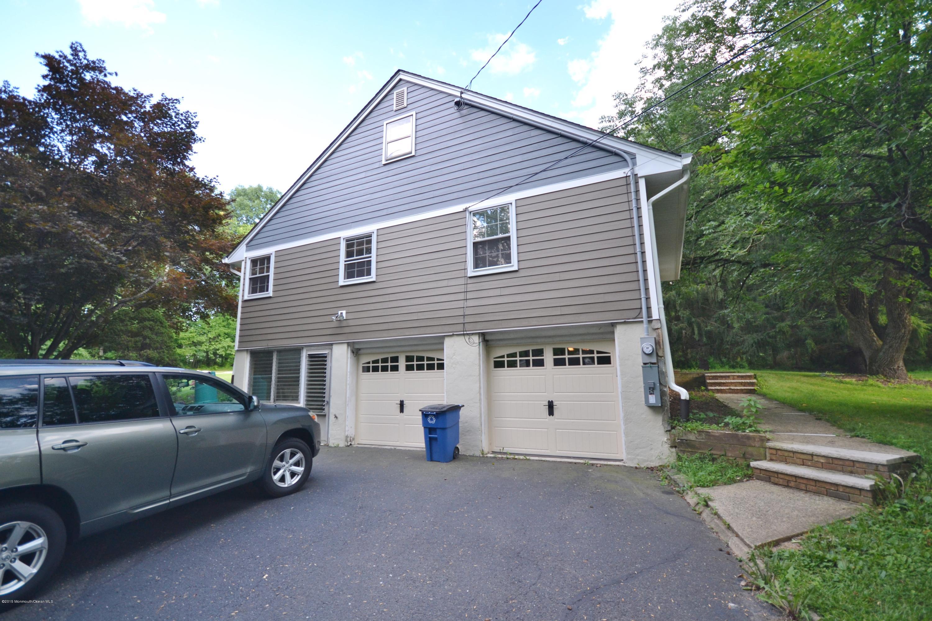 4 Spring Lane Warren, NJ 07059 - Photo 20 of 22 a view of a car parked in front of a house