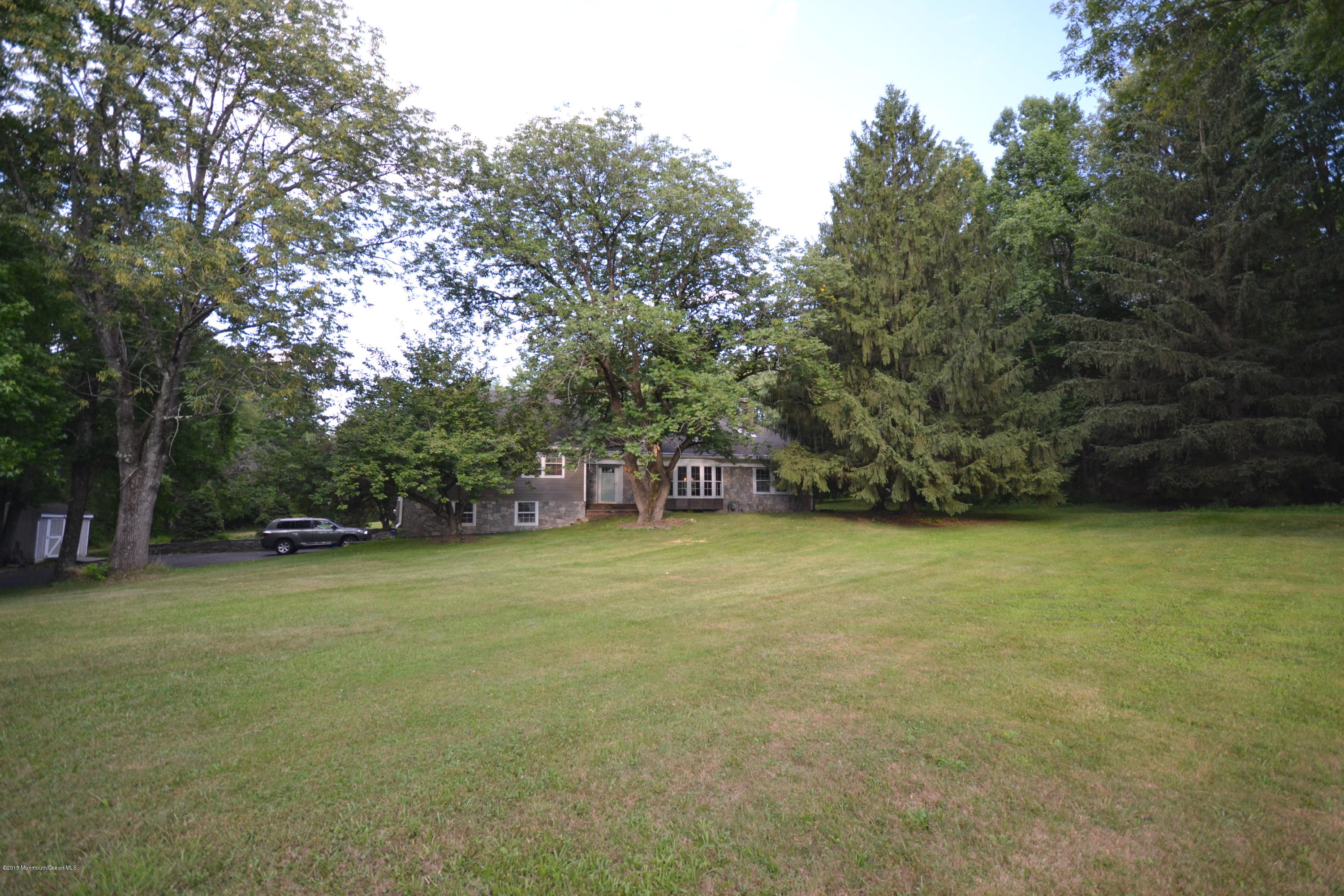 4 Spring Lane Warren, NJ 07059 - Photo 22 of 22 a view of a field with trees in front of it