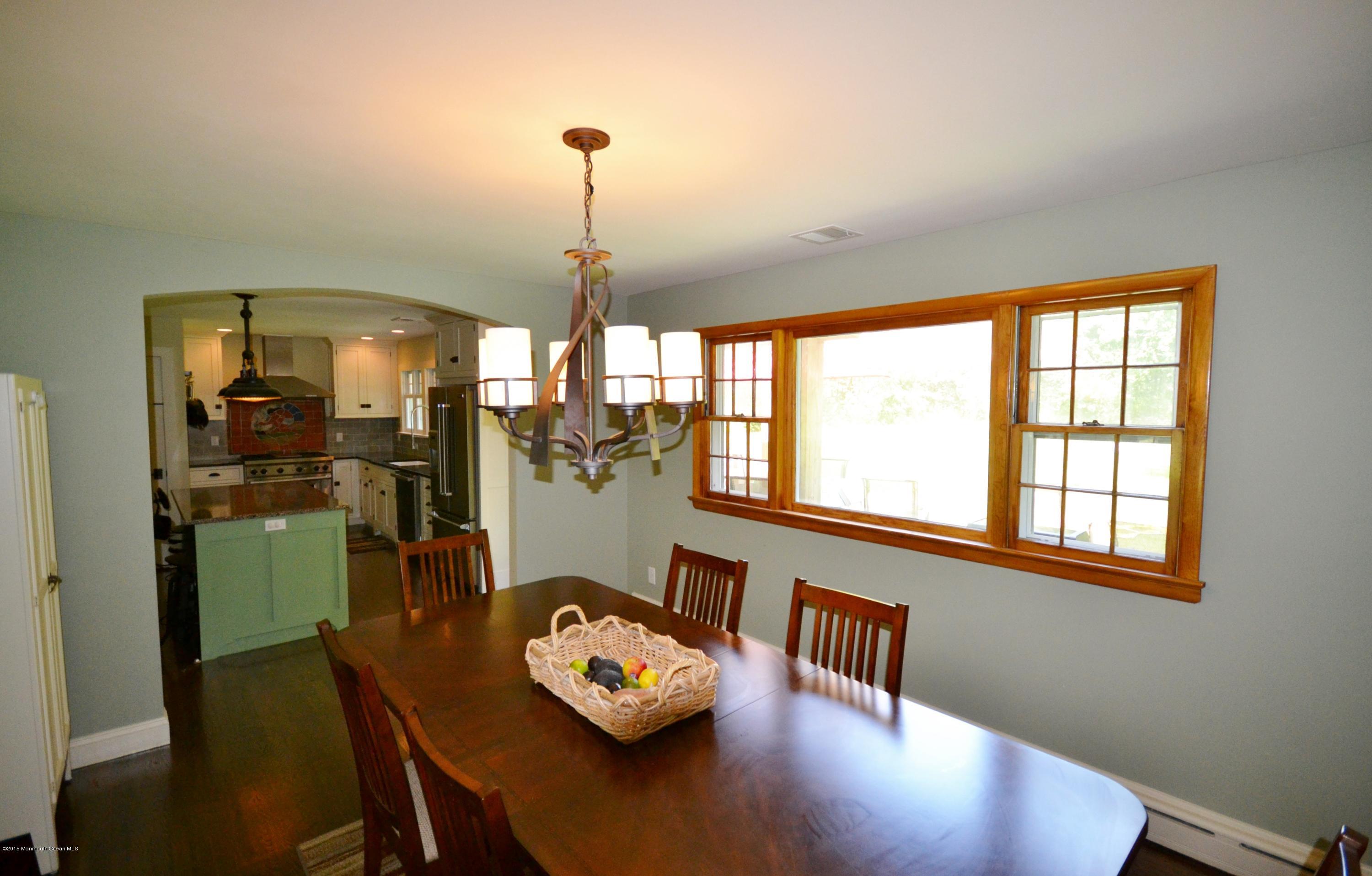 4 Spring Lane Warren, NJ 07059 - Photo 5 of 22 a view of a dining room with furniture a chandelier and wooden floor