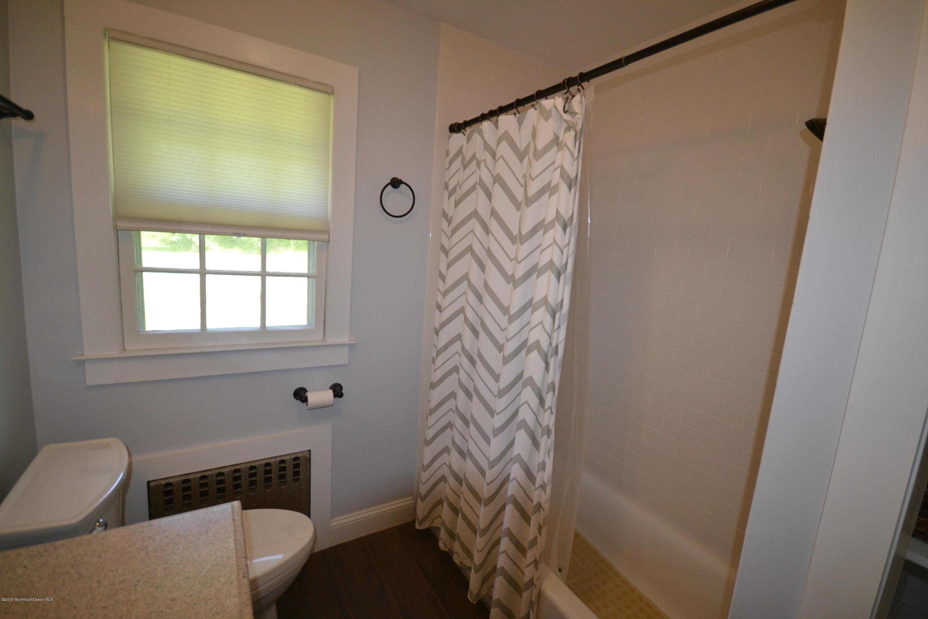 4 Spring Lane Warren, NJ 07059 - Photo 8 of 22 a bathroom with a toilet and a shower curtain