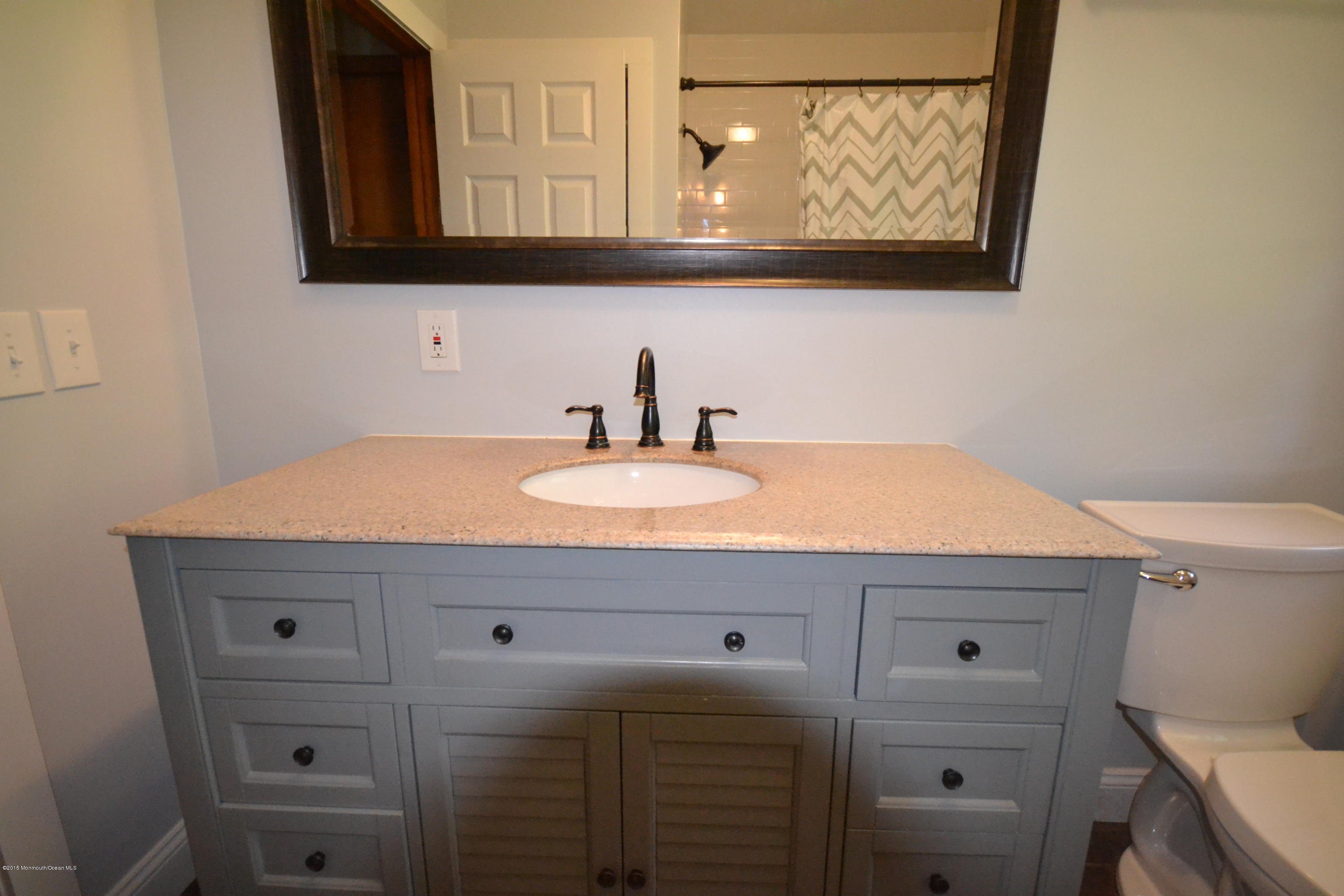 4 Spring Lane Warren, NJ 07059 - Photo 9 of 22 a bathroom with a sink vanity and a mirror