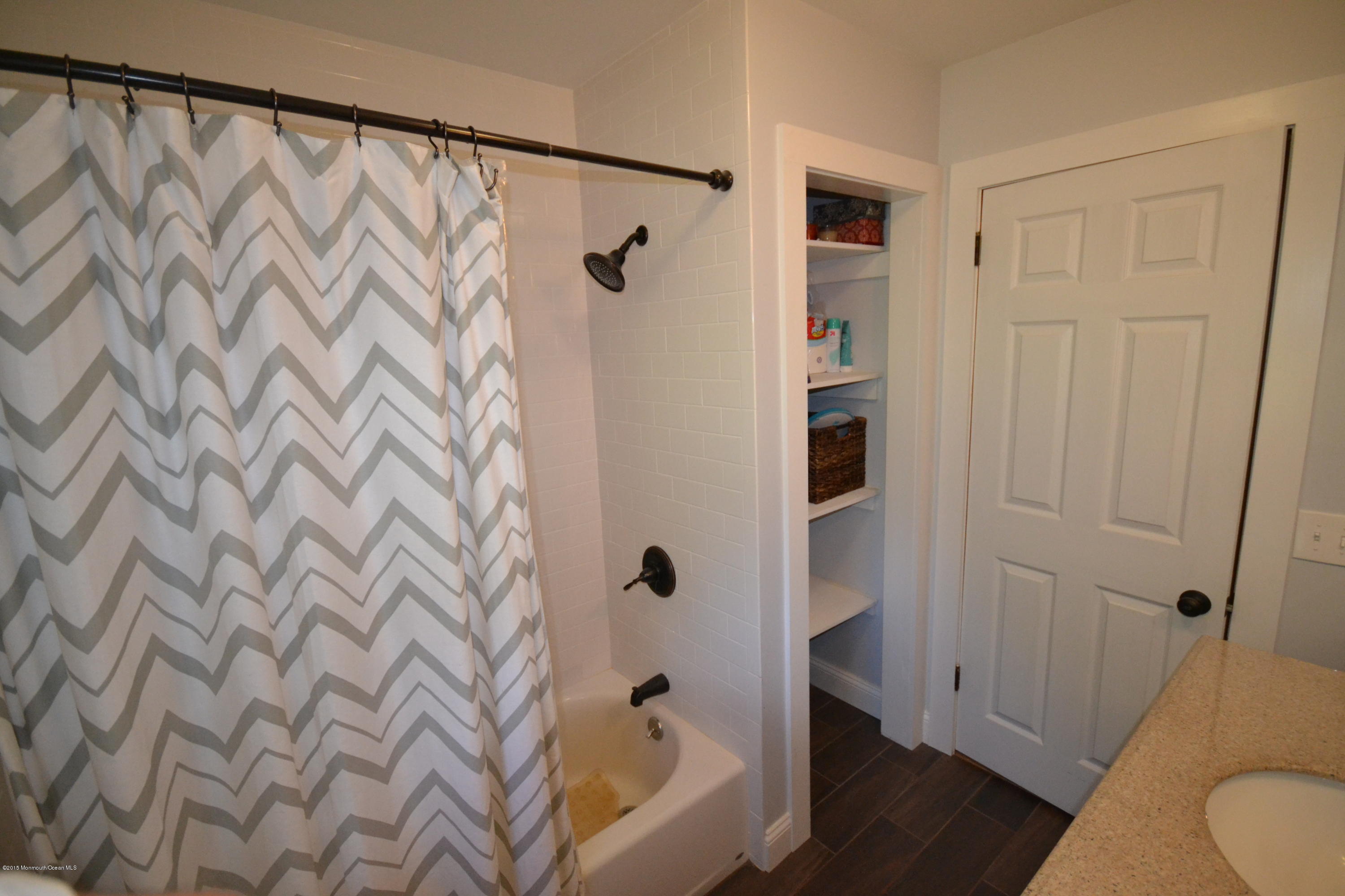 4 Spring Lane Warren, NJ 07059 - Photo 10 of 22 a bathroom with a shower curtain and a sink