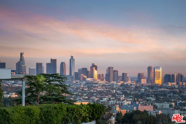 a view of a city with tall buildings in the background