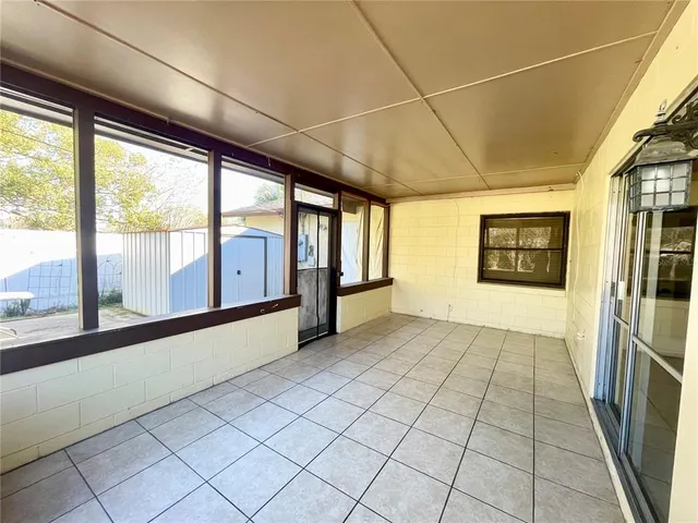 a view of a room with a large window