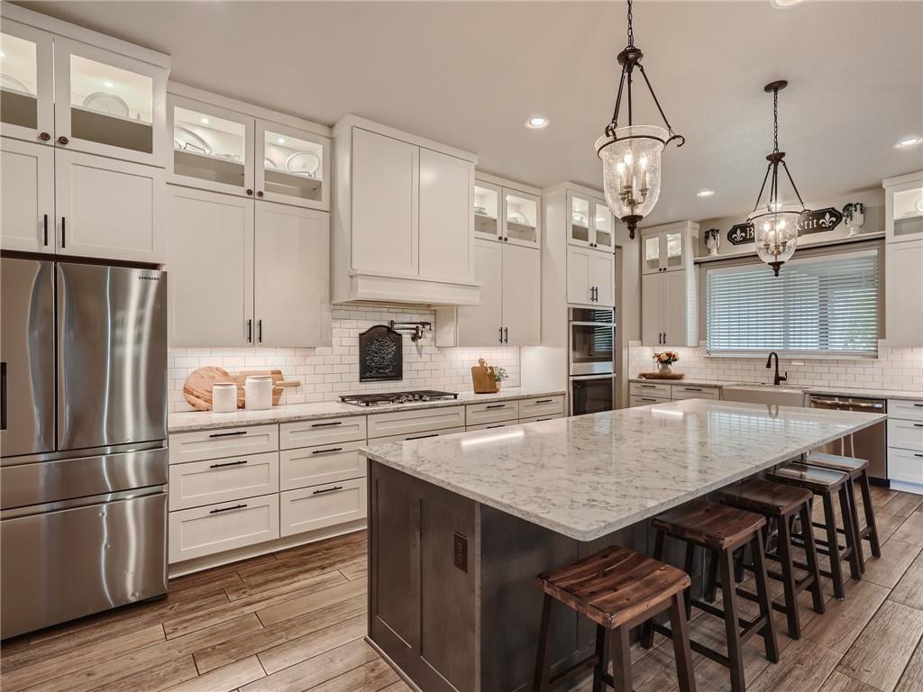 132 Huerta Road Florence, TX 76527 - Photo 8 of 40 An inviting kitchen with pristine cabinetry, sleek appliances, and a grand island for entertaining.