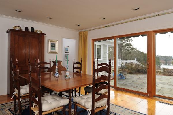 155 Ice Valley Road Osterville, MA 02655 - Photo 14 of 19 a view of a dining room with furniture and window