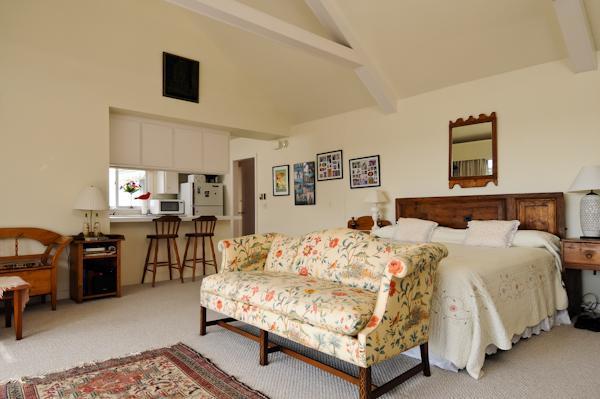 155 Ice Valley Road Osterville, MA 02655 - Photo 15 of 19 a bedroom with a bed couch and a window