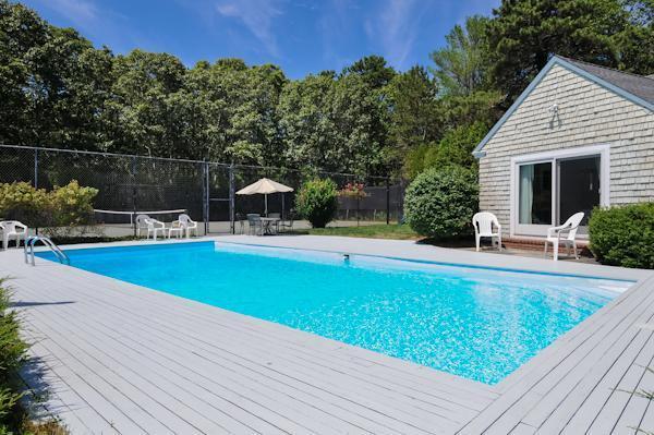155 Ice Valley Road Osterville, MA 02655 - Photo 5 of 19 a swimming pool with outdoor seating and yard