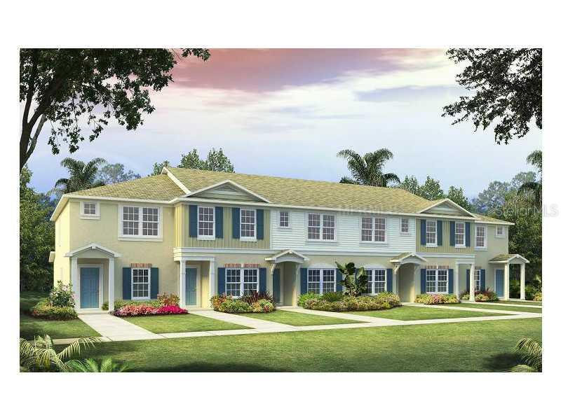 15942 Stable Run Drive Spring Hill, FL 34610 - Photo 1 of 1 a front view of a house with a garden