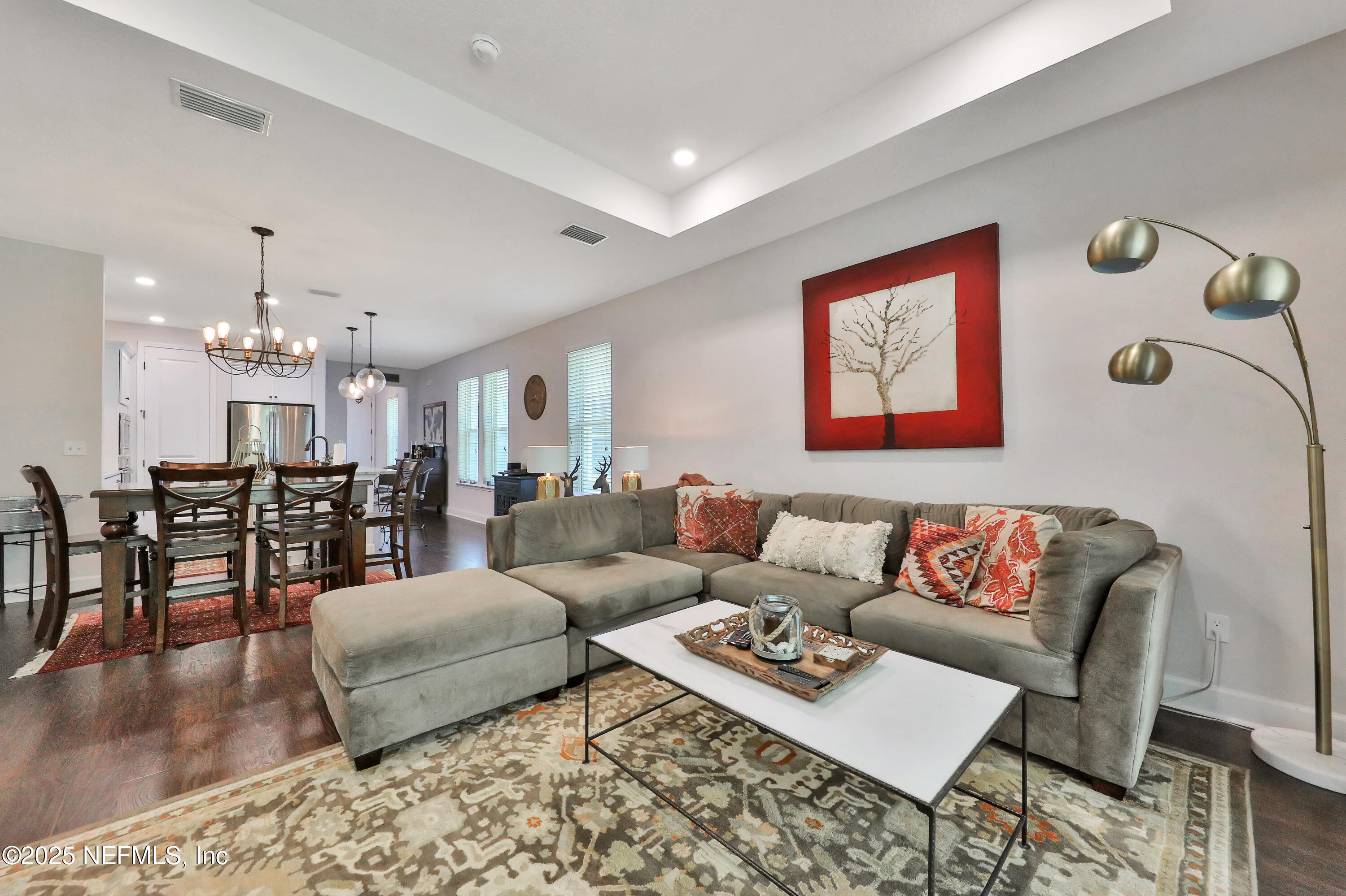 123 Bison Trail Ponte Vedra, FL 32081 - Photo 12 of 23 a living room with furniture kitchen view and a dining table