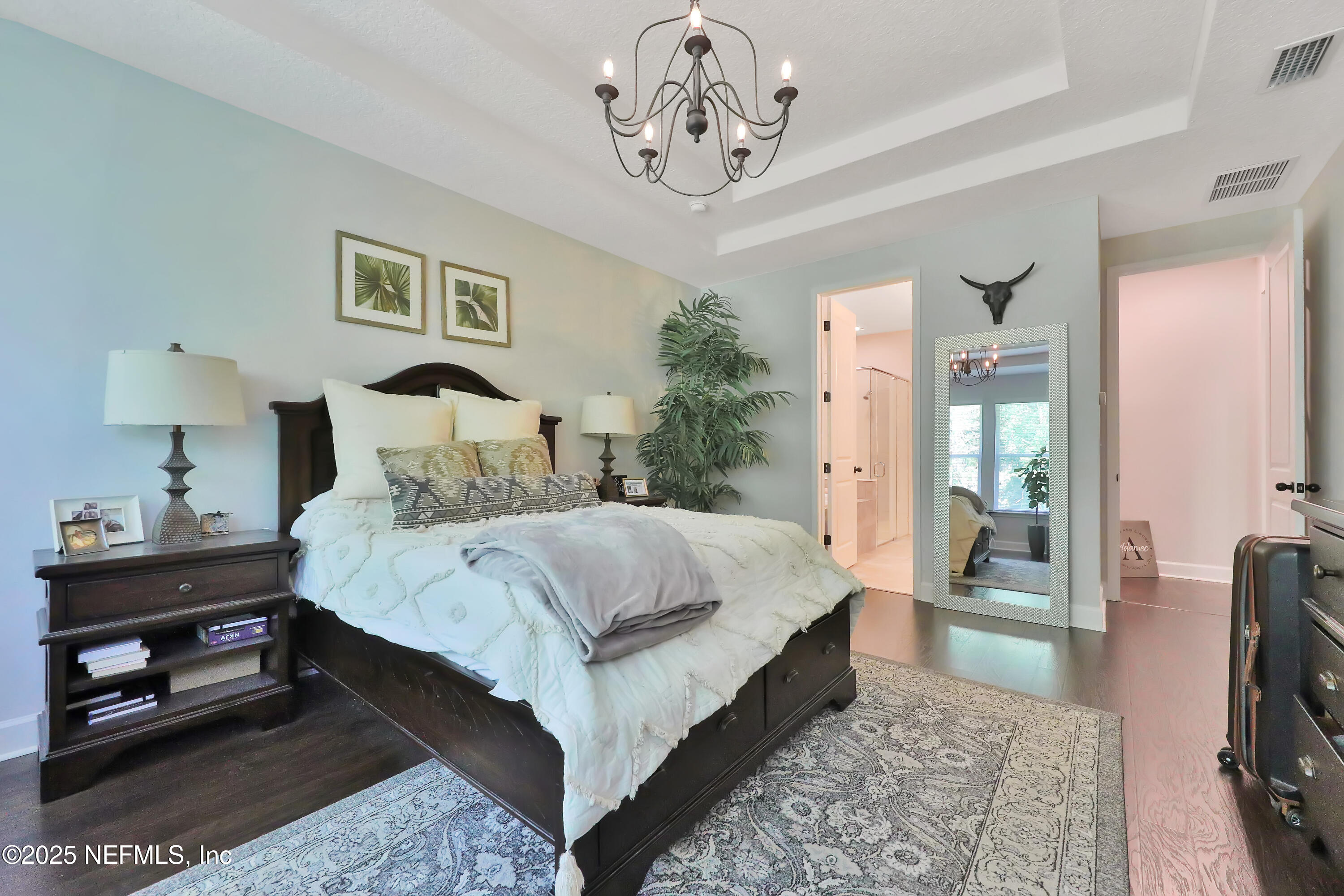 123 Bison Trail Ponte Vedra, FL 32081 - Photo 15 of 23 a bedroom with a bed a rug and a chair