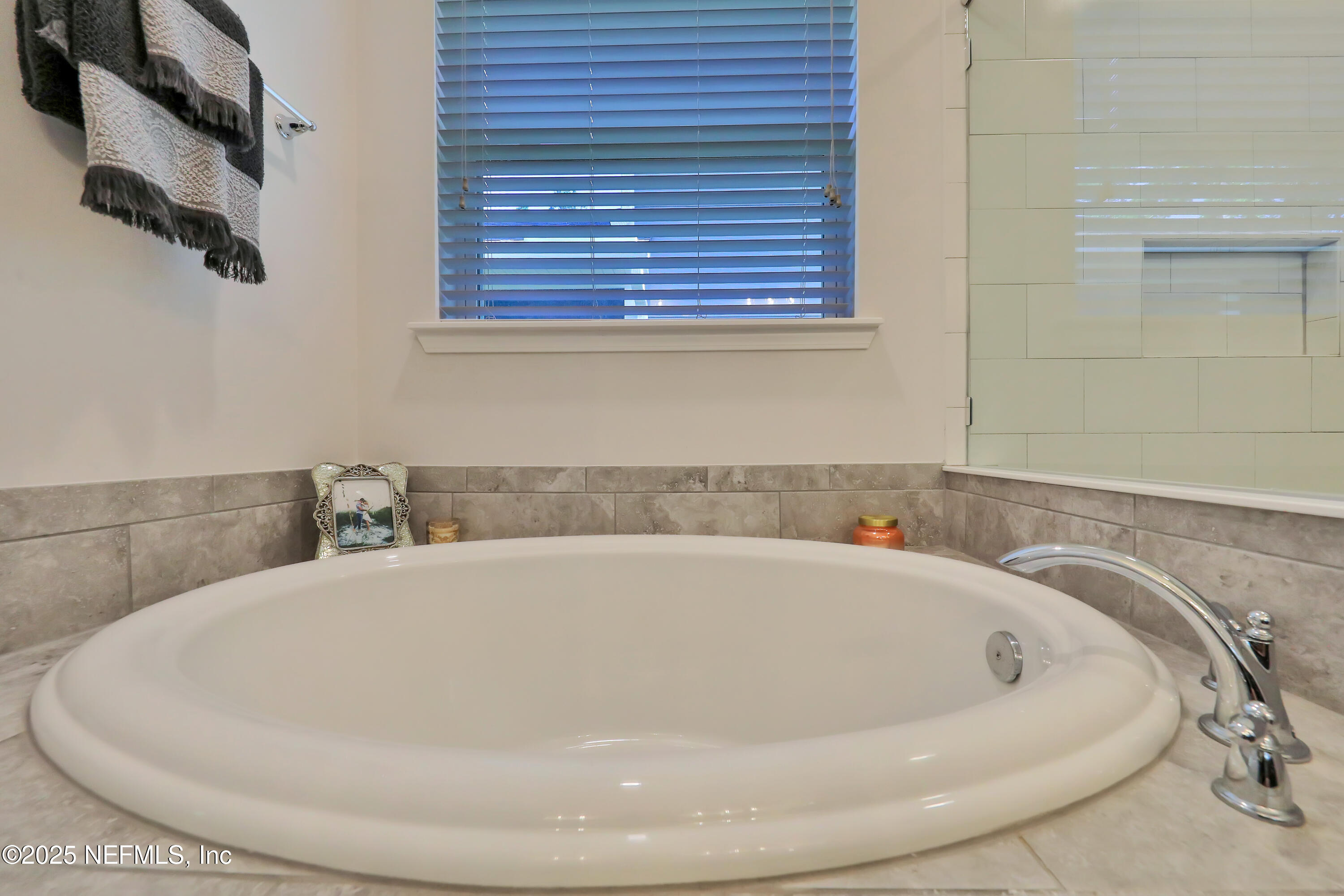 123 Bison Trail Ponte Vedra, FL 32081 - Photo 19 of 23 a white bath tub sitting in a bathroom