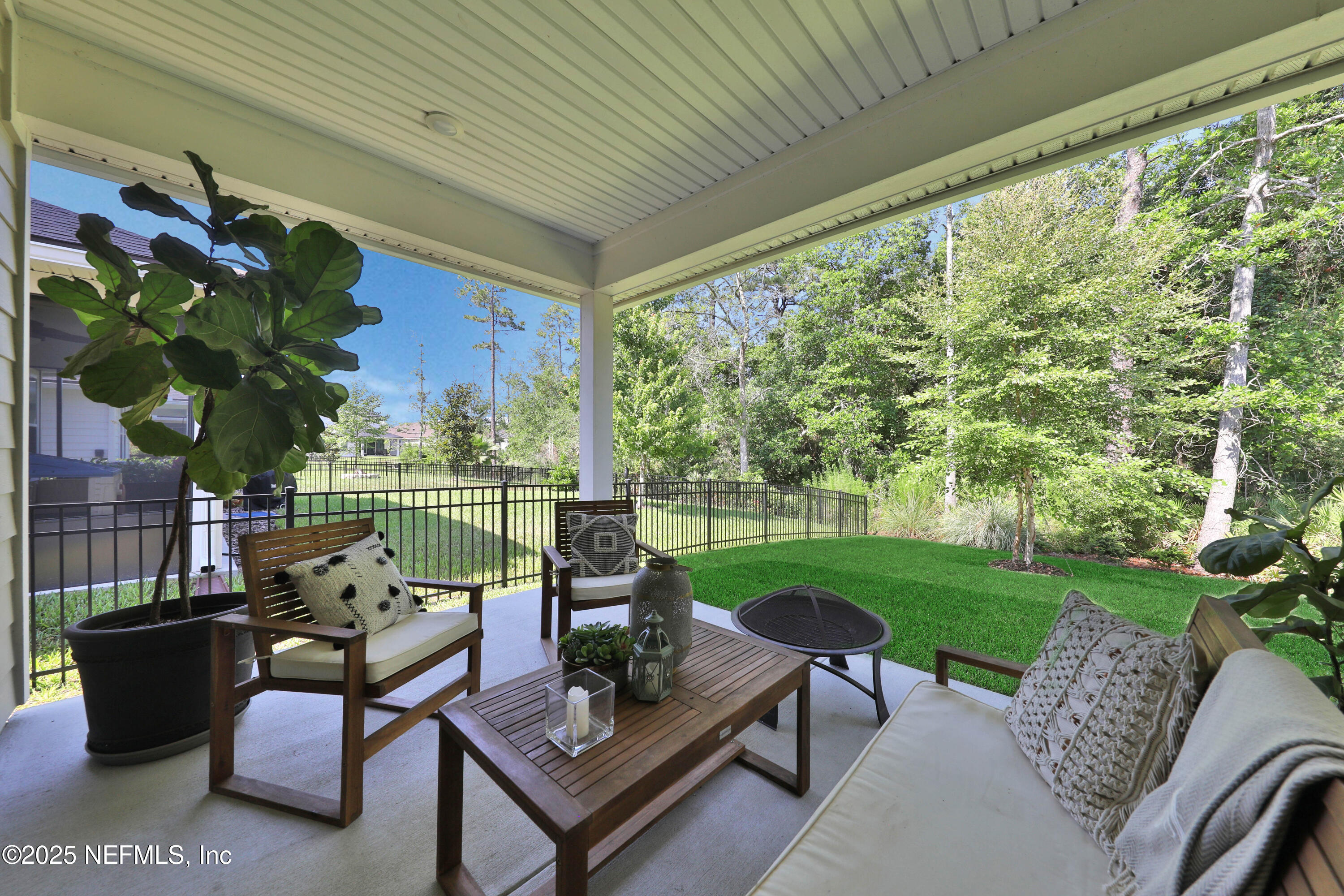 123 Bison Trail Ponte Vedra, FL 32081 - Photo 20 of 23 a view of a patio with couches plants and a big yard