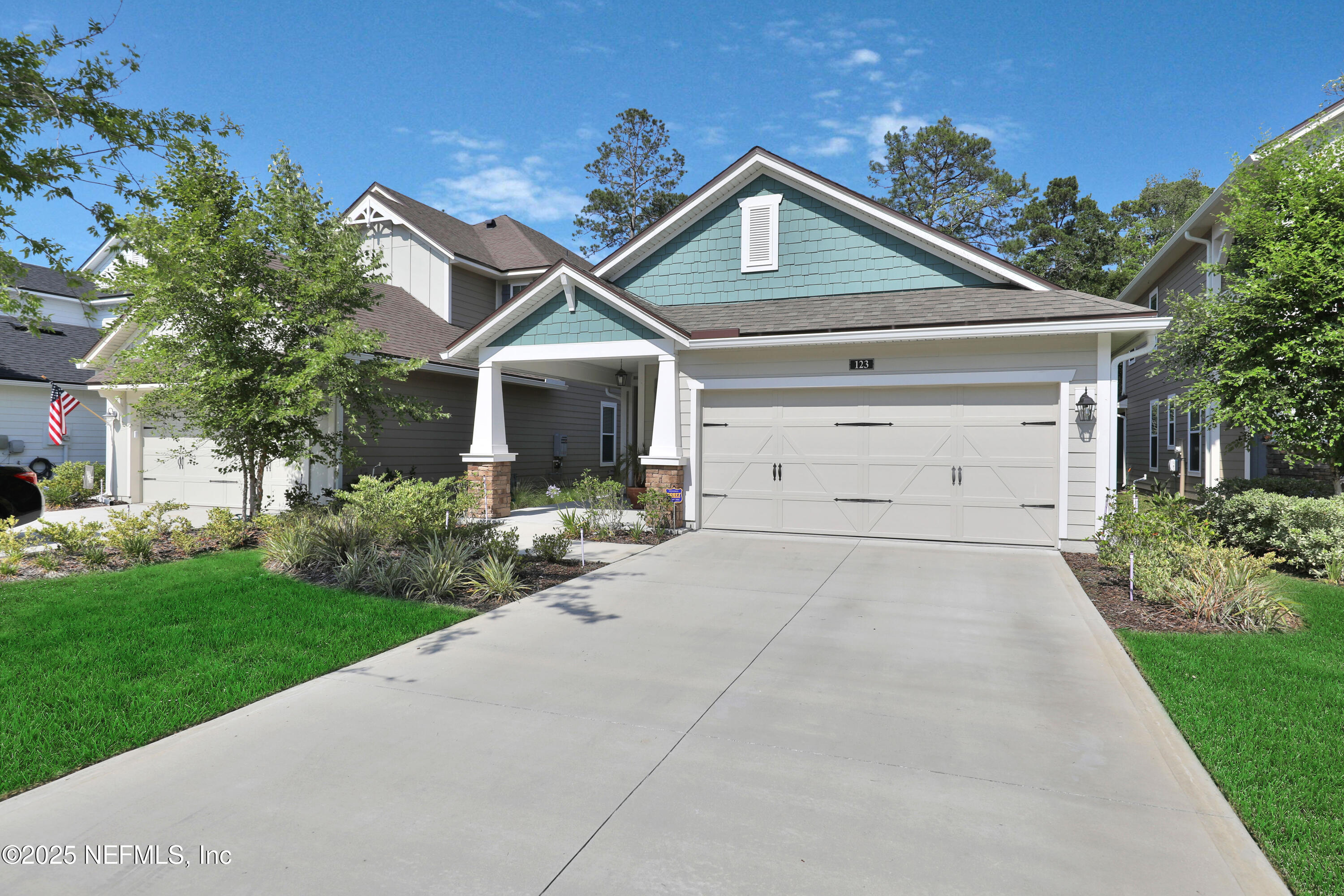 123 Bison Trail Ponte Vedra, FL 32081 - Photo 2 of 23 a front view of a house with a yard and garage