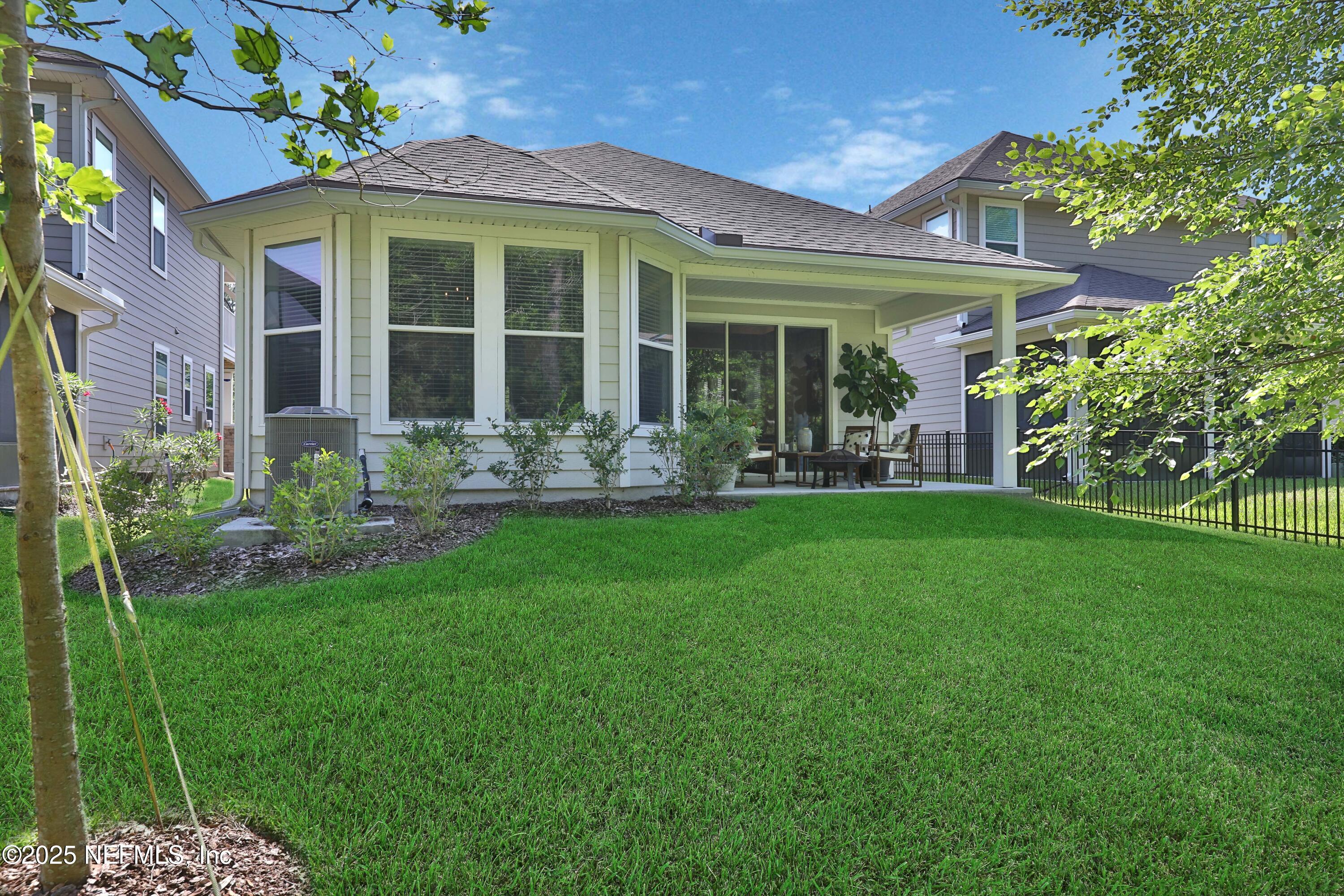 123 Bison Trail Ponte Vedra, FL 32081 - Photo 21 of 23 a front view of a house with garden and porch