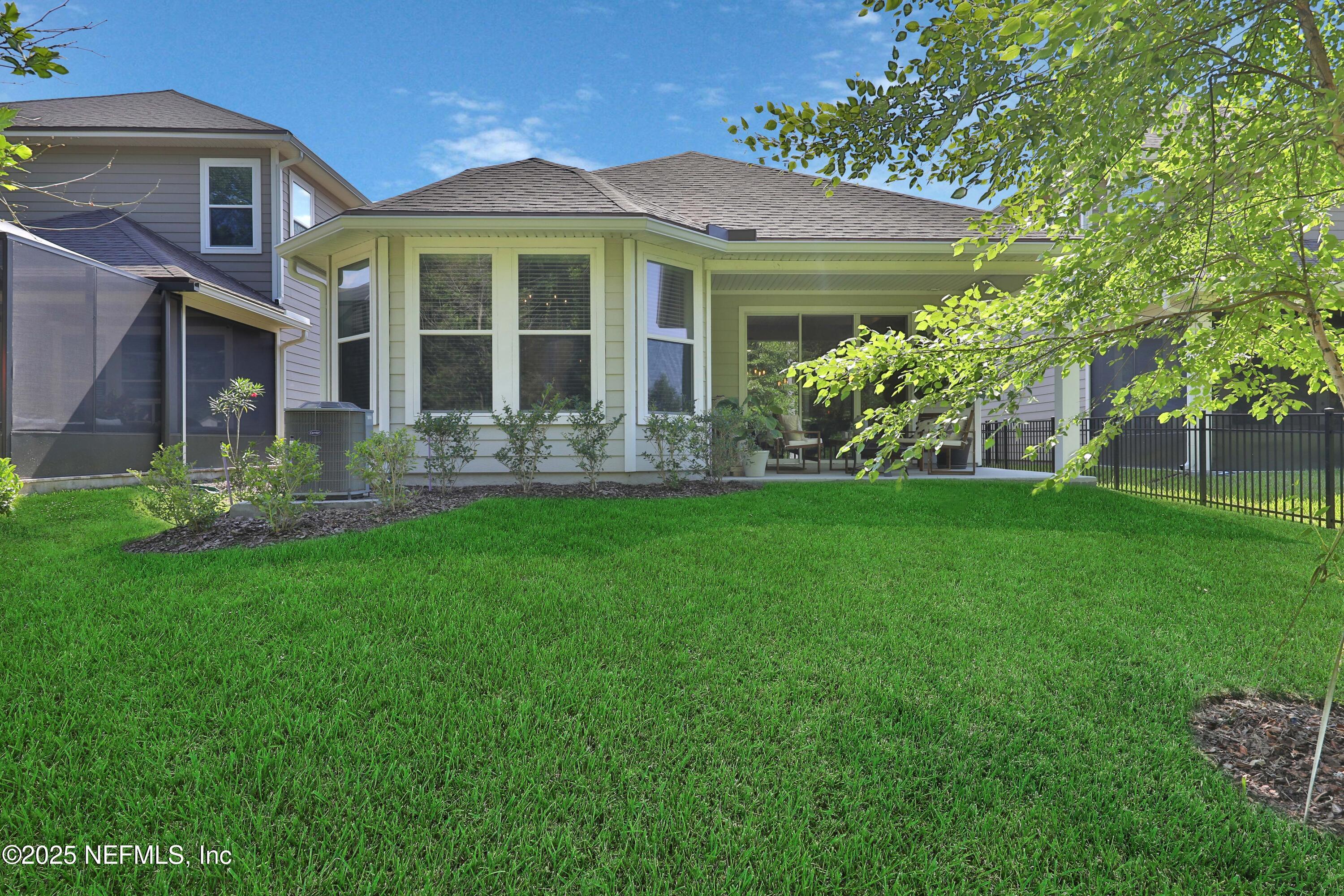 123 Bison Trail Ponte Vedra, FL 32081 - Photo 22 of 23 a front view of a house with garden and porch