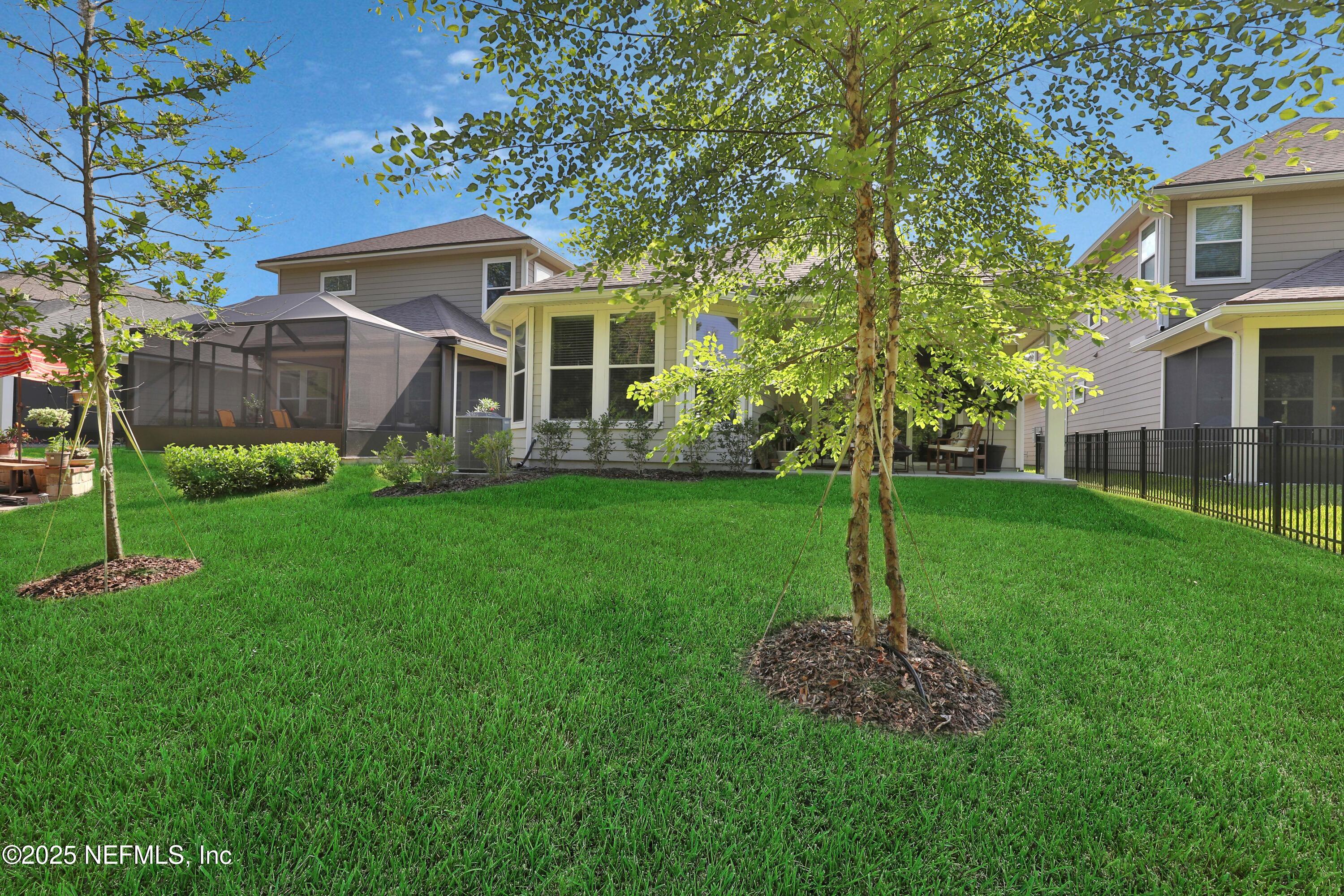 123 Bison Trail Ponte Vedra, FL 32081 - Photo 23 of 23 a front view of a house with a yard and tree