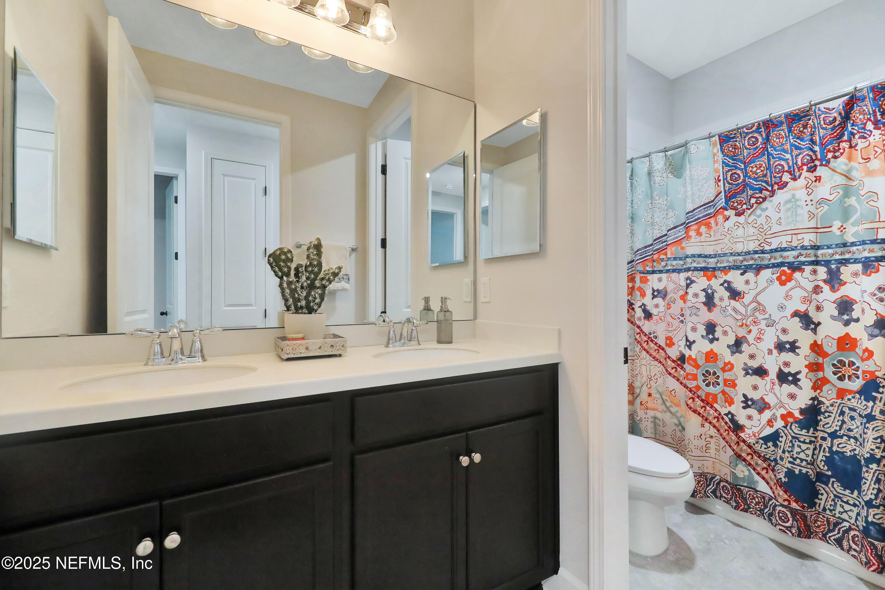 123 Bison Trail Ponte Vedra, FL 32081 - Photo 6 of 23 a bathroom with a granite countertop toilet sink and mirror
