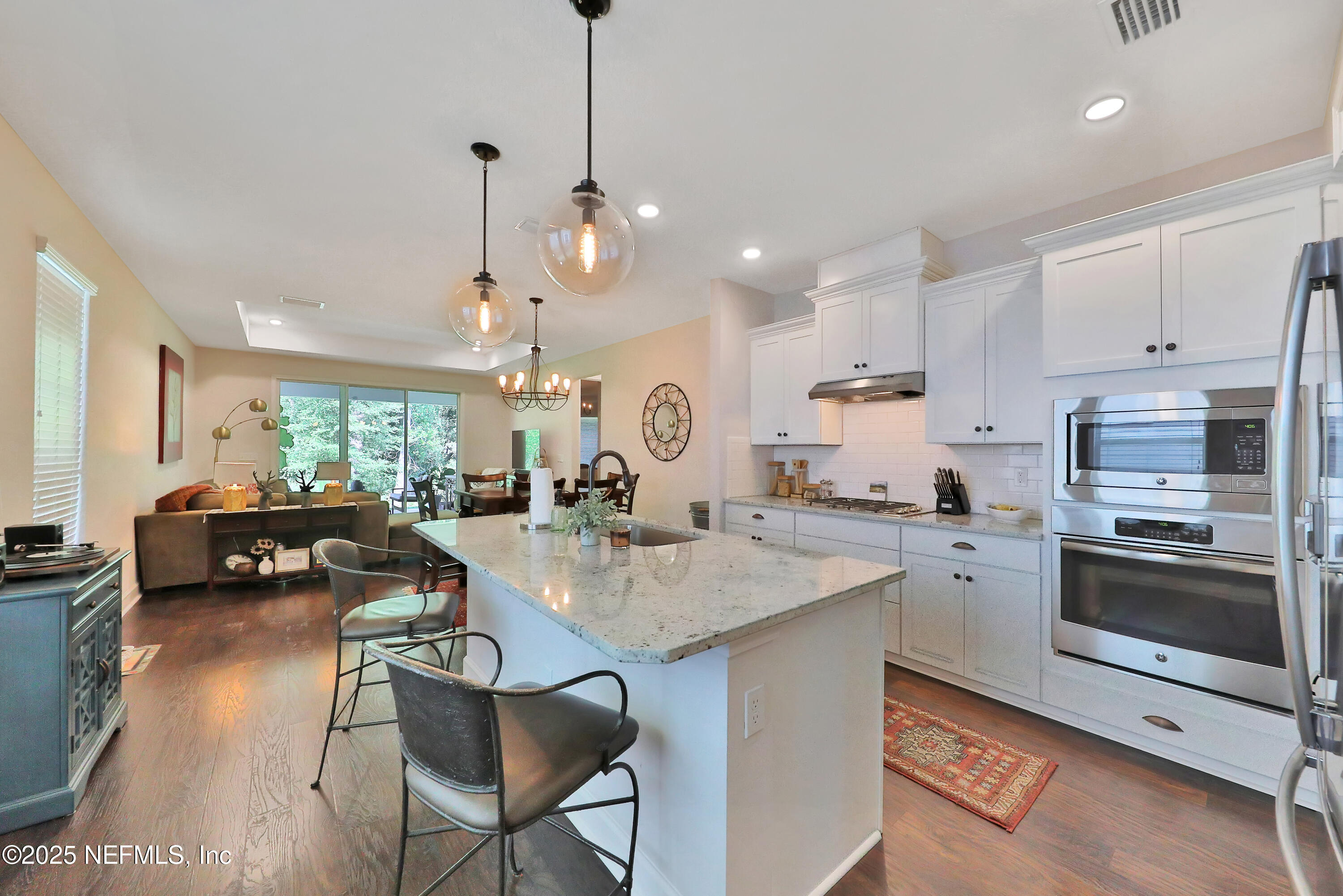 123 Bison Trail Ponte Vedra, FL 32081 - Photo 7 of 23 a kitchen with sink stove and cabinets