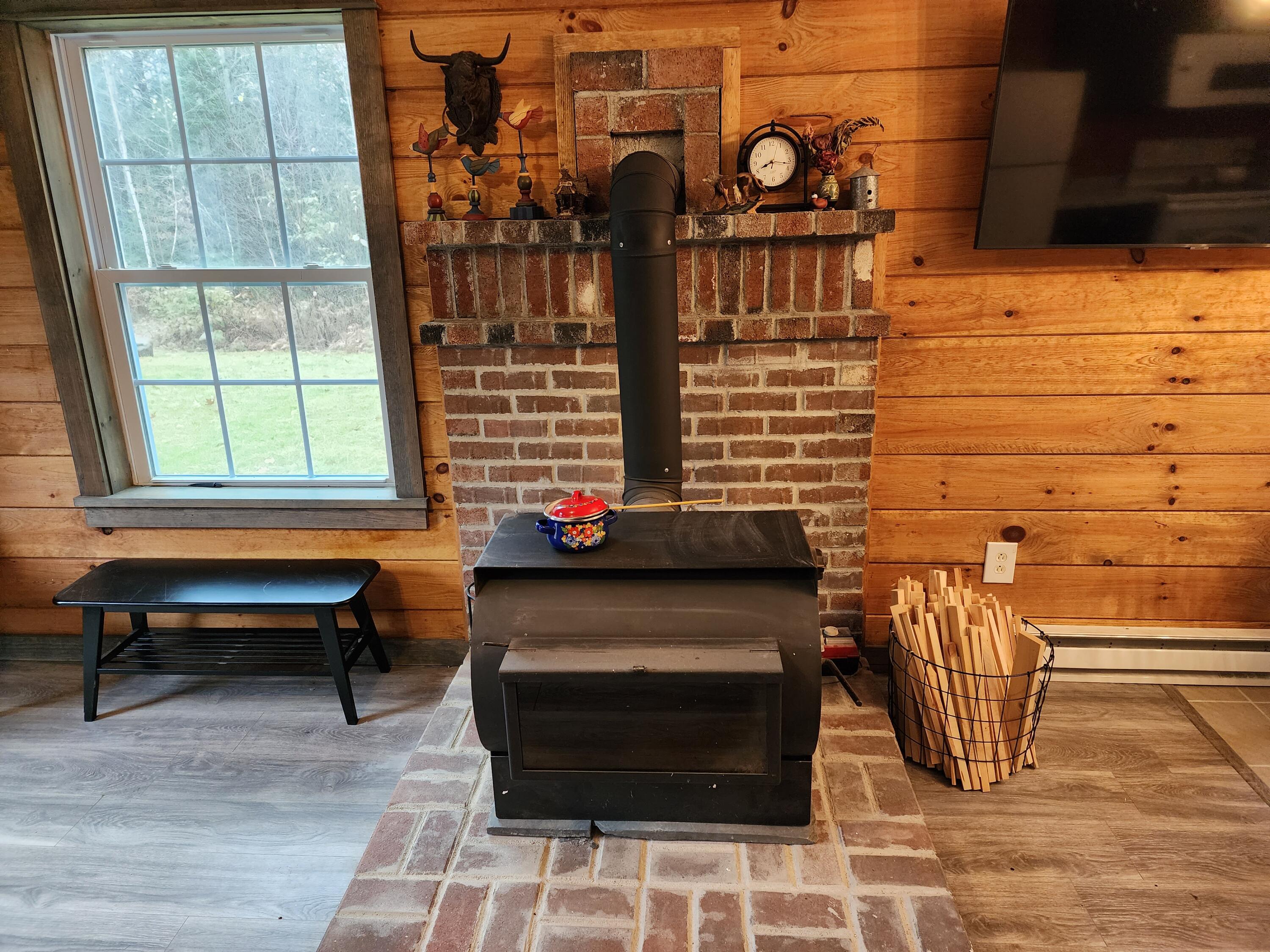 231 Swan Road New Sharon, ME 04955 - Photo 17 of 32 Woodstoves make everything cozier!