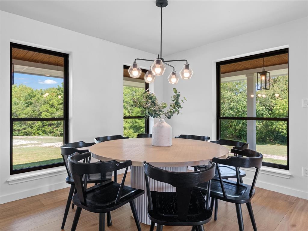 946 Burke Road Gunter, TX 75058 - Photo 11 of 38 a view of a dining room with furniture window and wooden floor