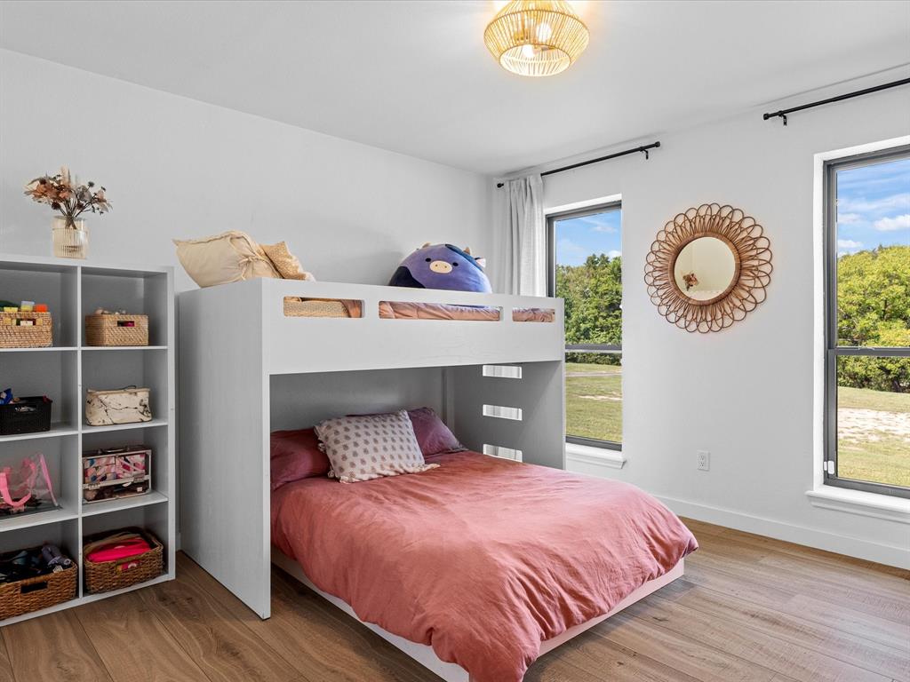 946 Burke Road Gunter, TX 75058 - Photo 20 of 38 a bedroom with a bed and a window