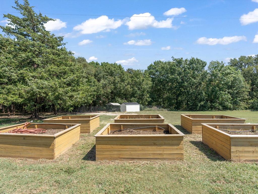 946 Burke Road Gunter, TX 75058 - Photo 31 of 38 a view of swimming pool with seating area and trees in the background