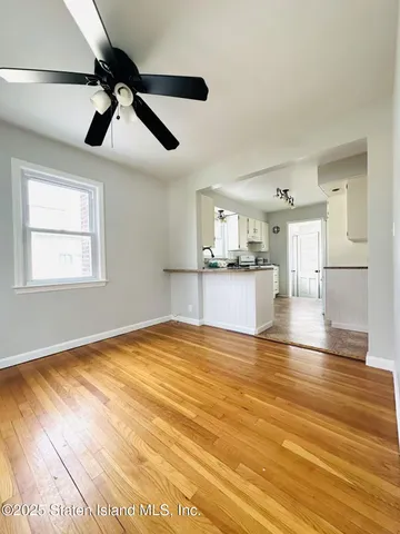 a kitchen with kitchen island sink refrigerator and cabinets