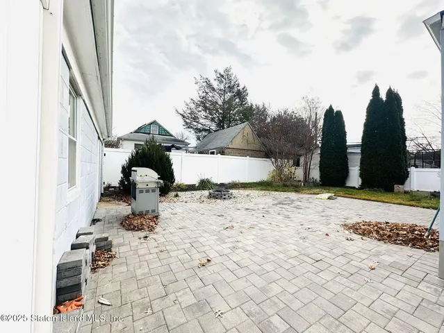 a view of a backyard of the house