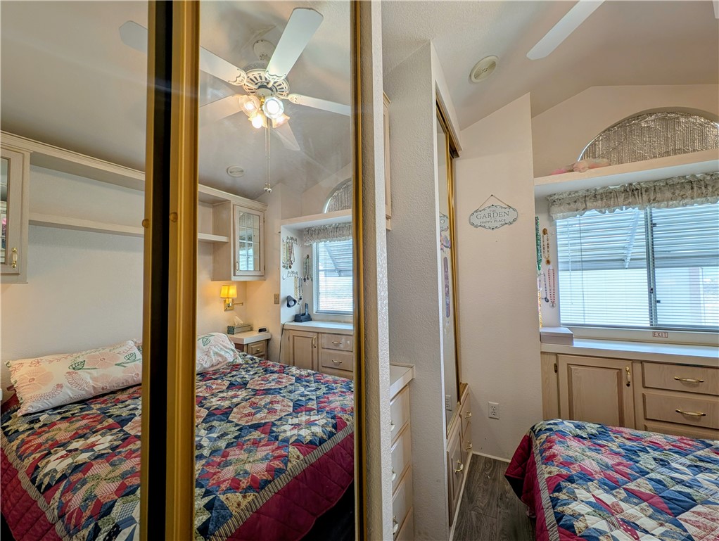2000 Ramar Road, Unit 280 Bullhead City, AZ 86442 - Photo 38 of 63 a bedroom with a bed and a chandelier