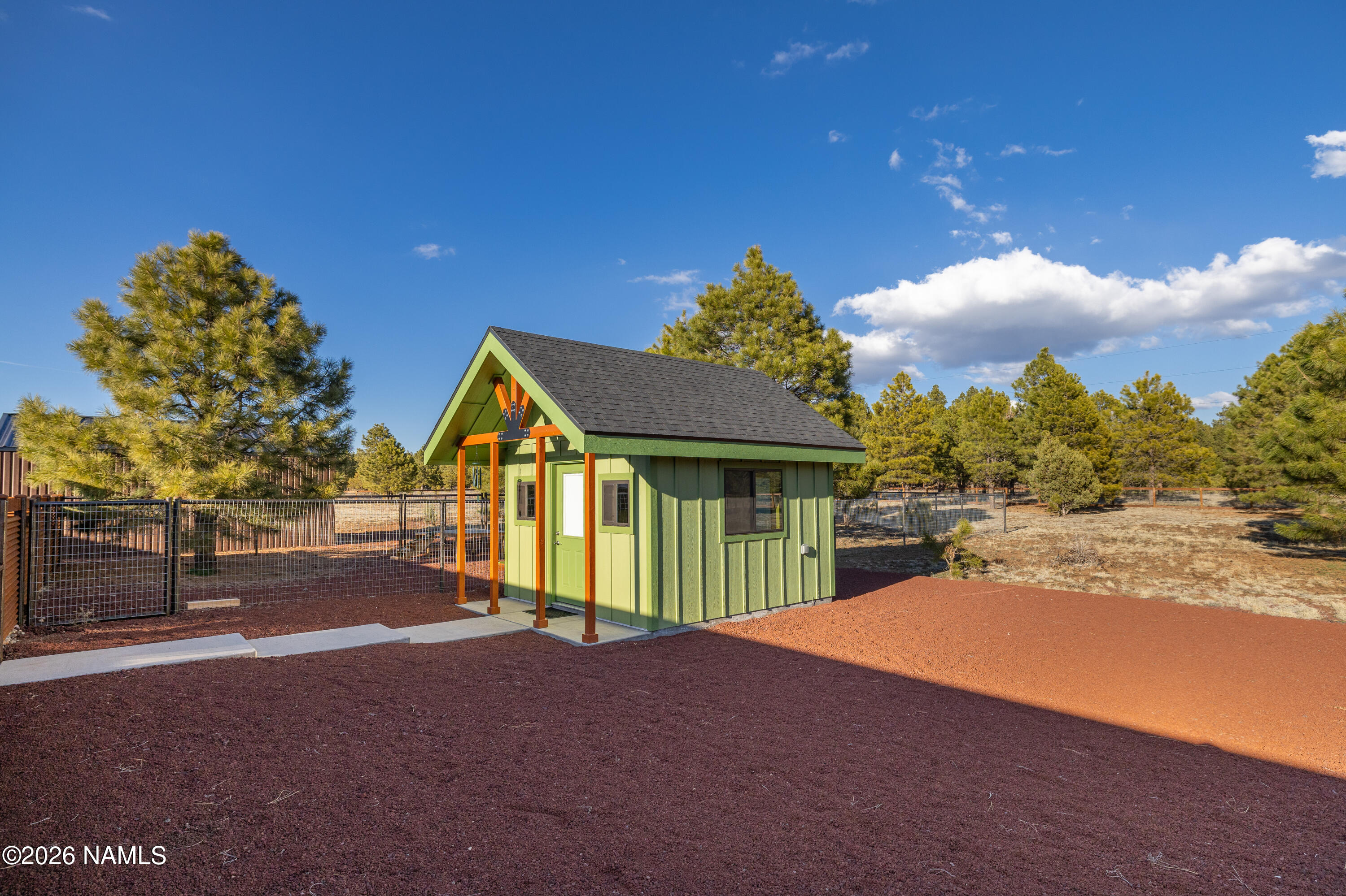 1150 North Three Bears Loop Parks, AZ 86018 - Photo 48 of 82 a house with trees in the background