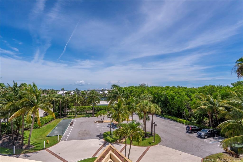 221 Northeast Plantation Road, Unit 407 Stuart, FL 34996 - Photo 14 of 42 a view of a pathway with a garden